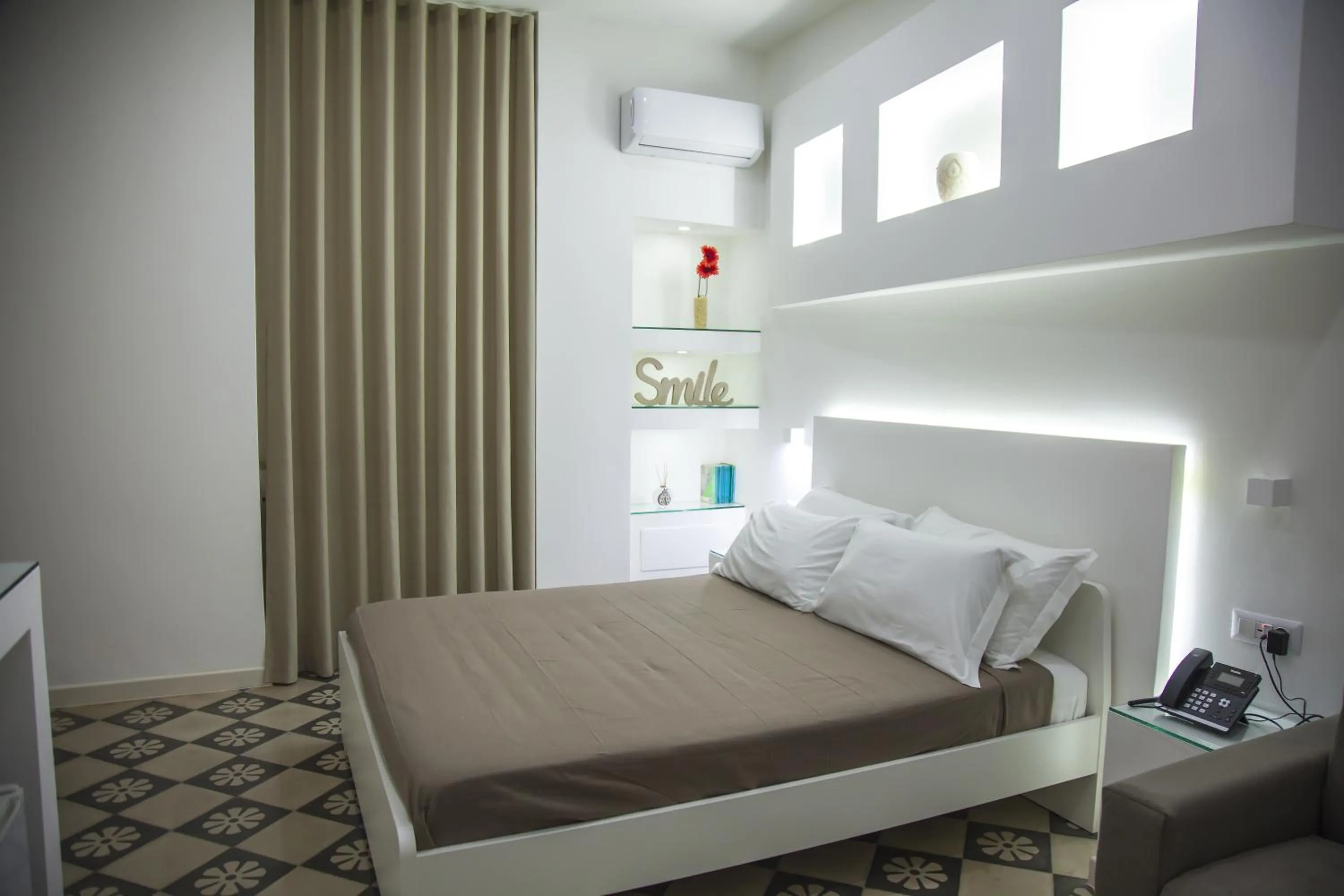 Bed in VILLA ADELAIDE SUITE & ROOM