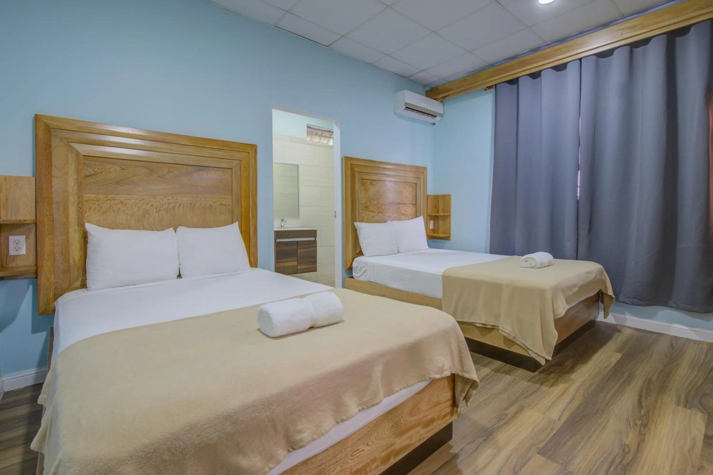 Bed in Airport Suites Hotel