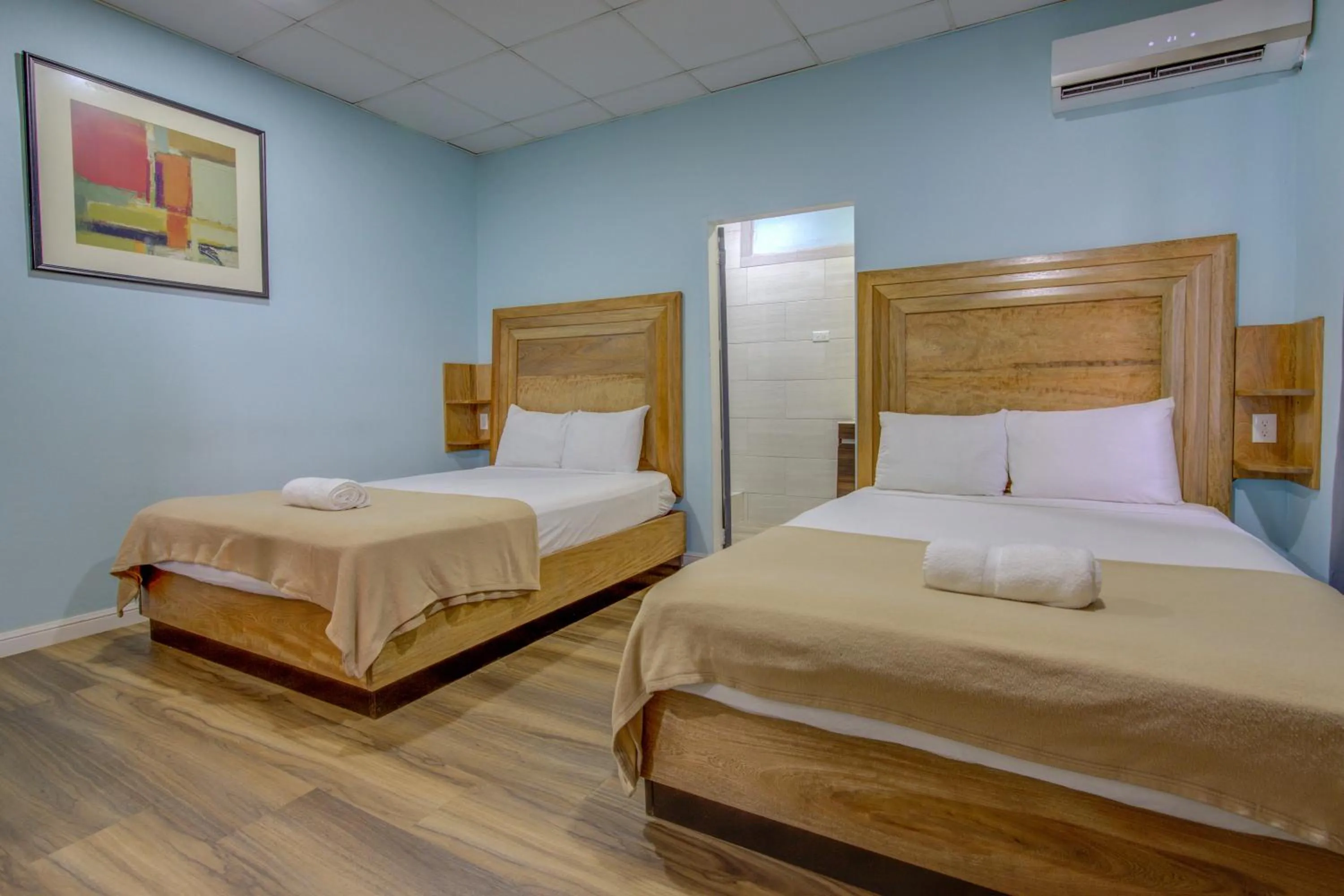 Bed in Airport Suites Hotel