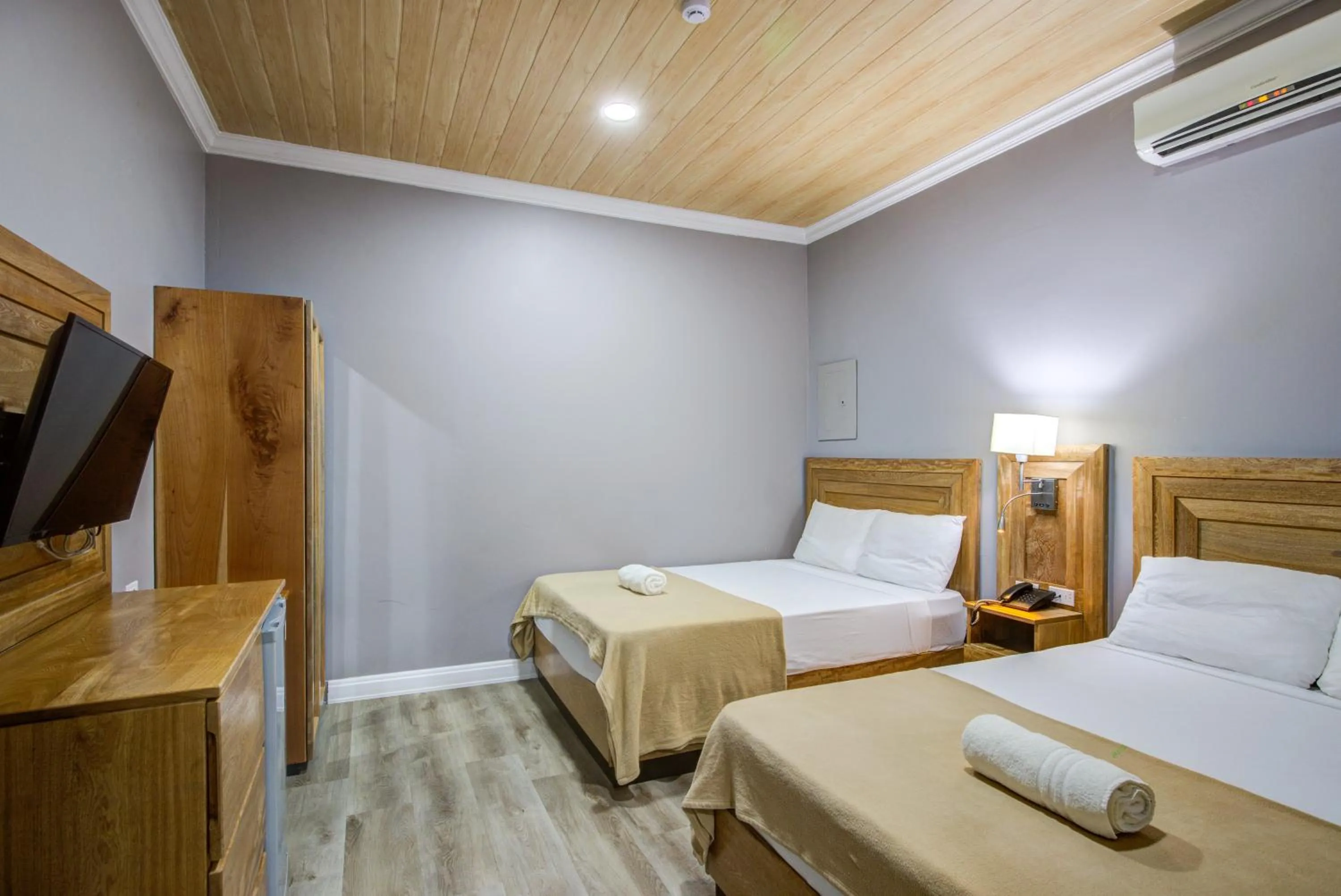 Bed in Airport Suites Hotel