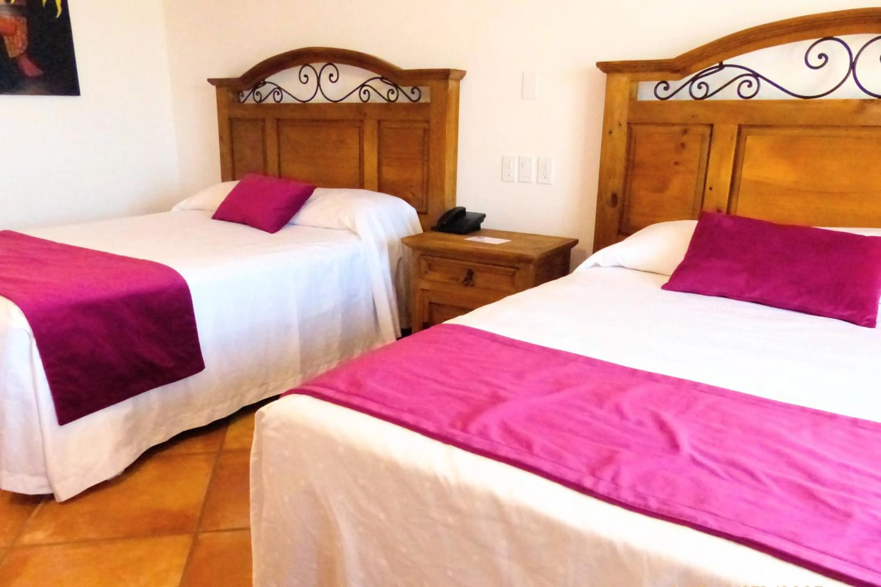 Bed in Hotel Hacienda Bugambilias La Paz