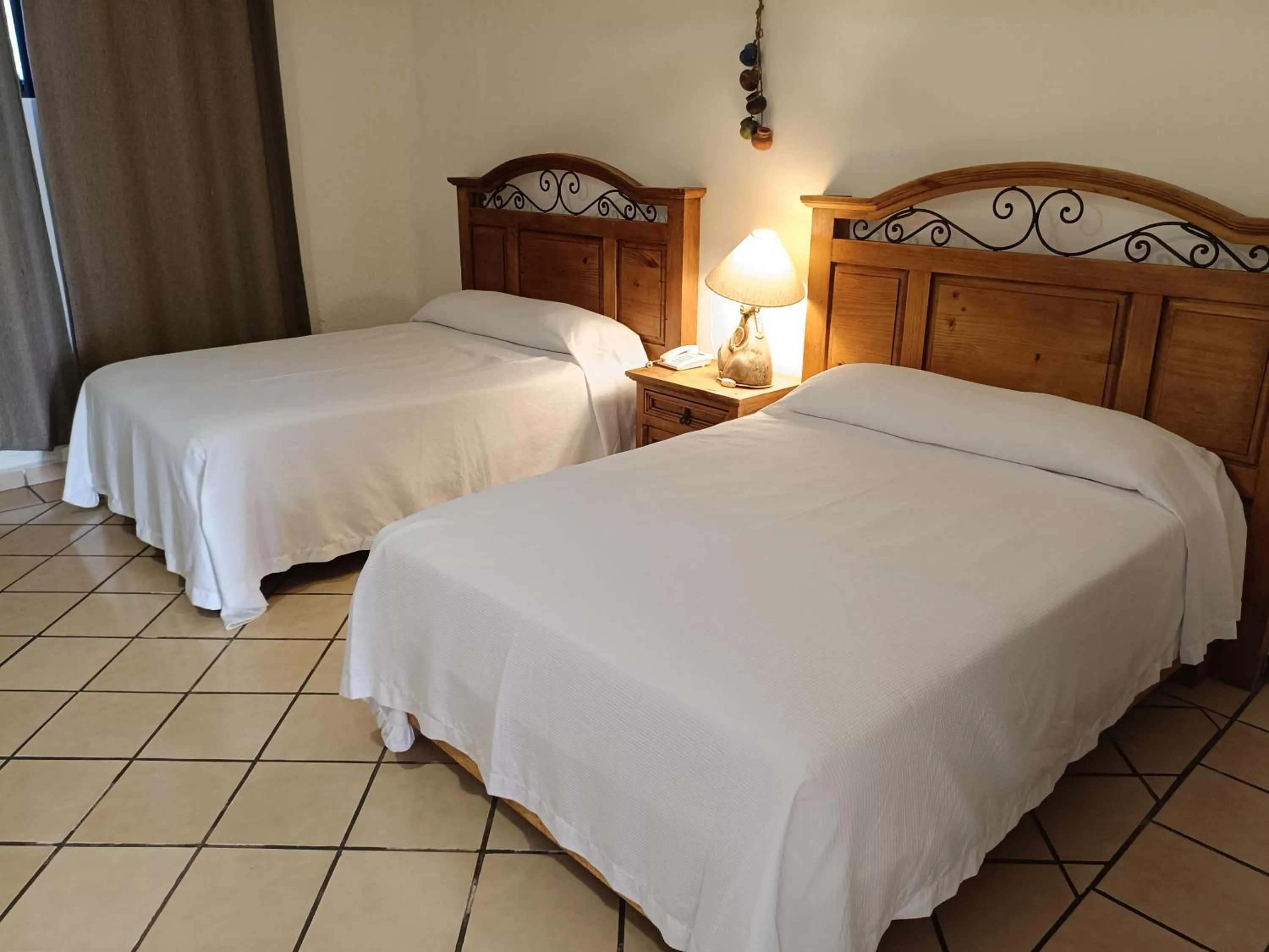 Bed in Hotel Hacienda Bugambilias La Paz