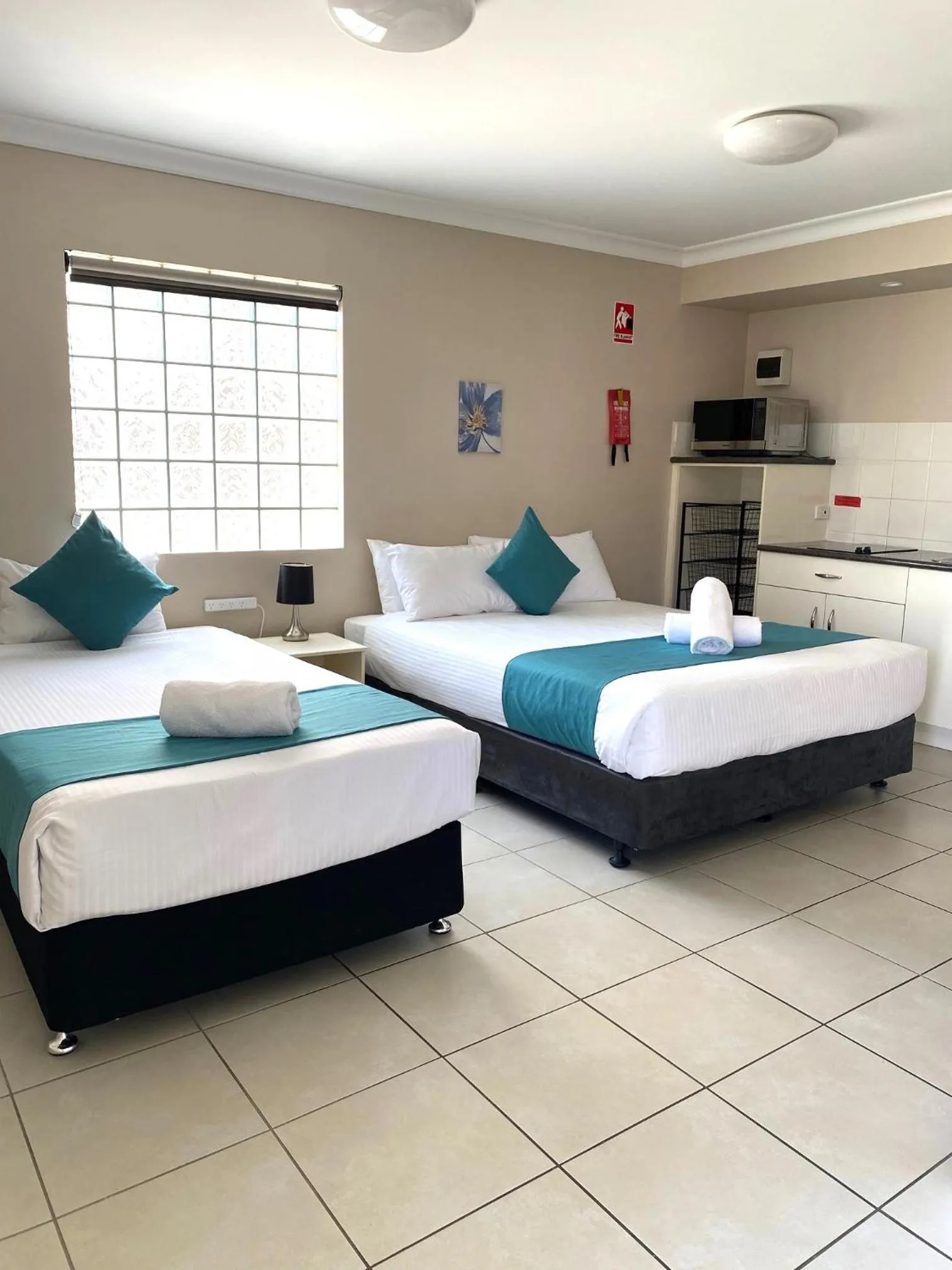 Bed in Cityville Apartments & Motel