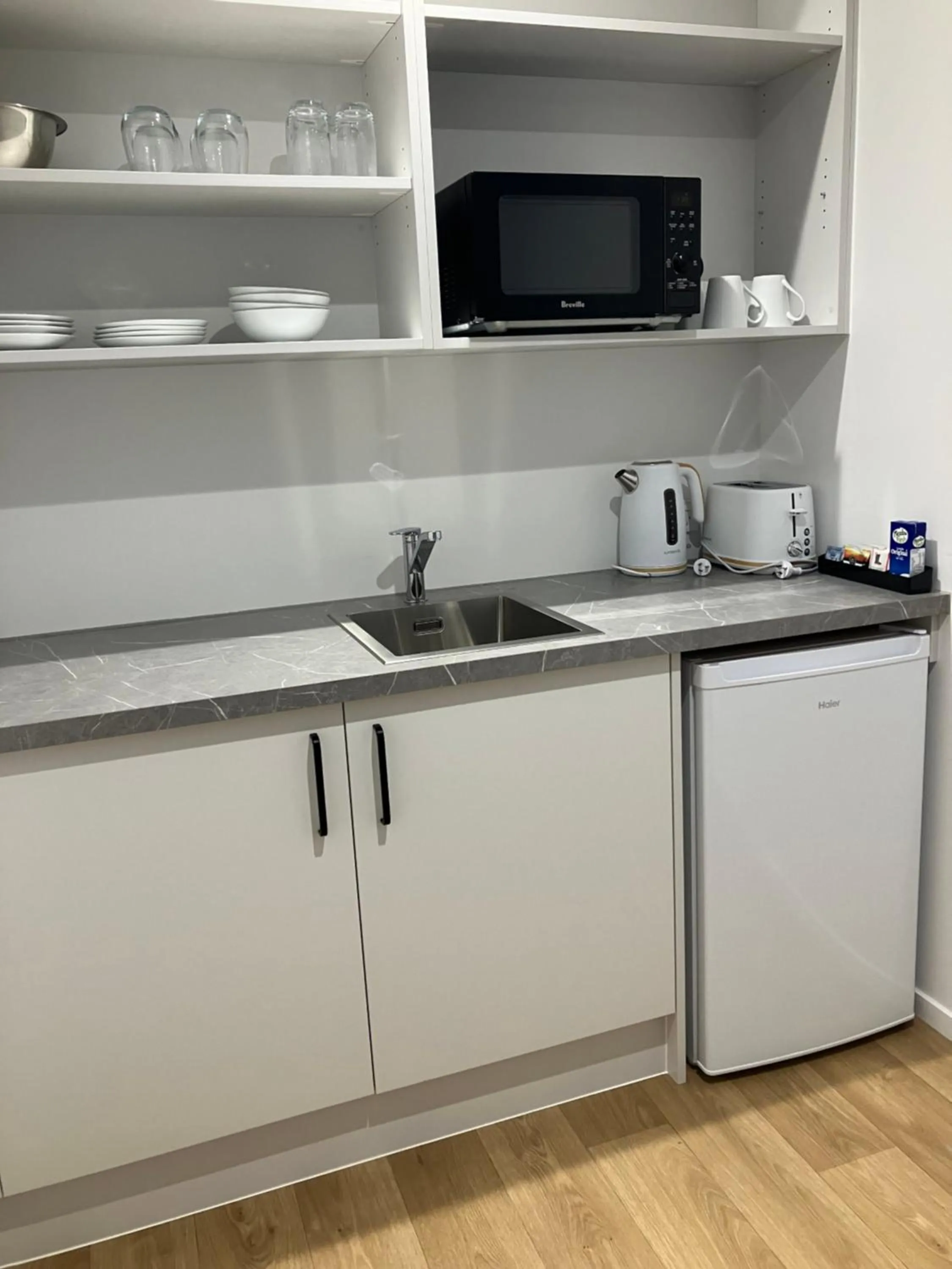 Kitchen or kitchenette in Tripinn Modern Motels & Affordable Accommodation