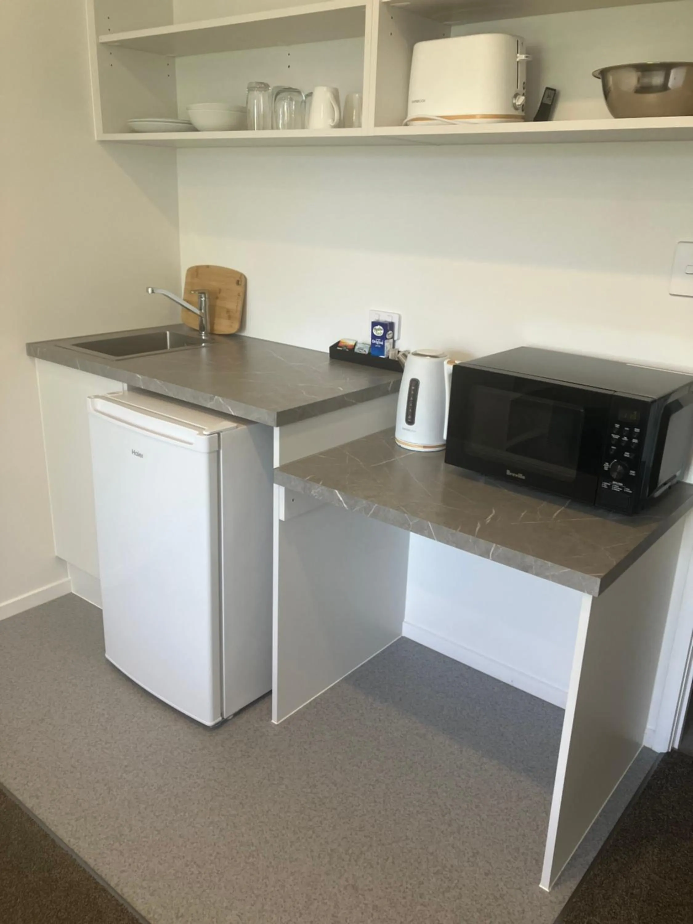 Kitchen or kitchenette in Tripinn Modern Motels & Affordable Accommodation