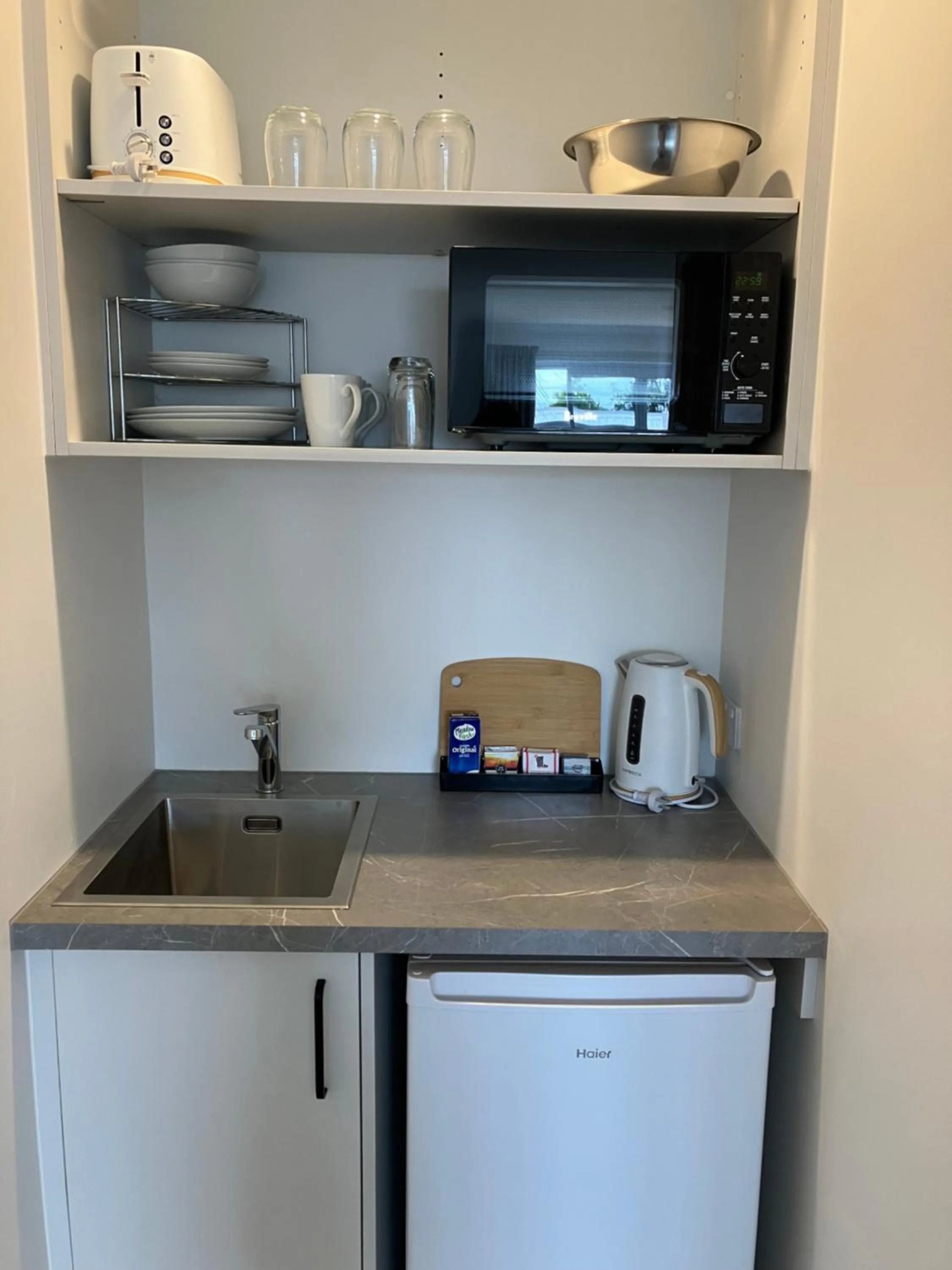 Kitchen or kitchenette in Tripinn Modern Motels & Affordable Accommodation