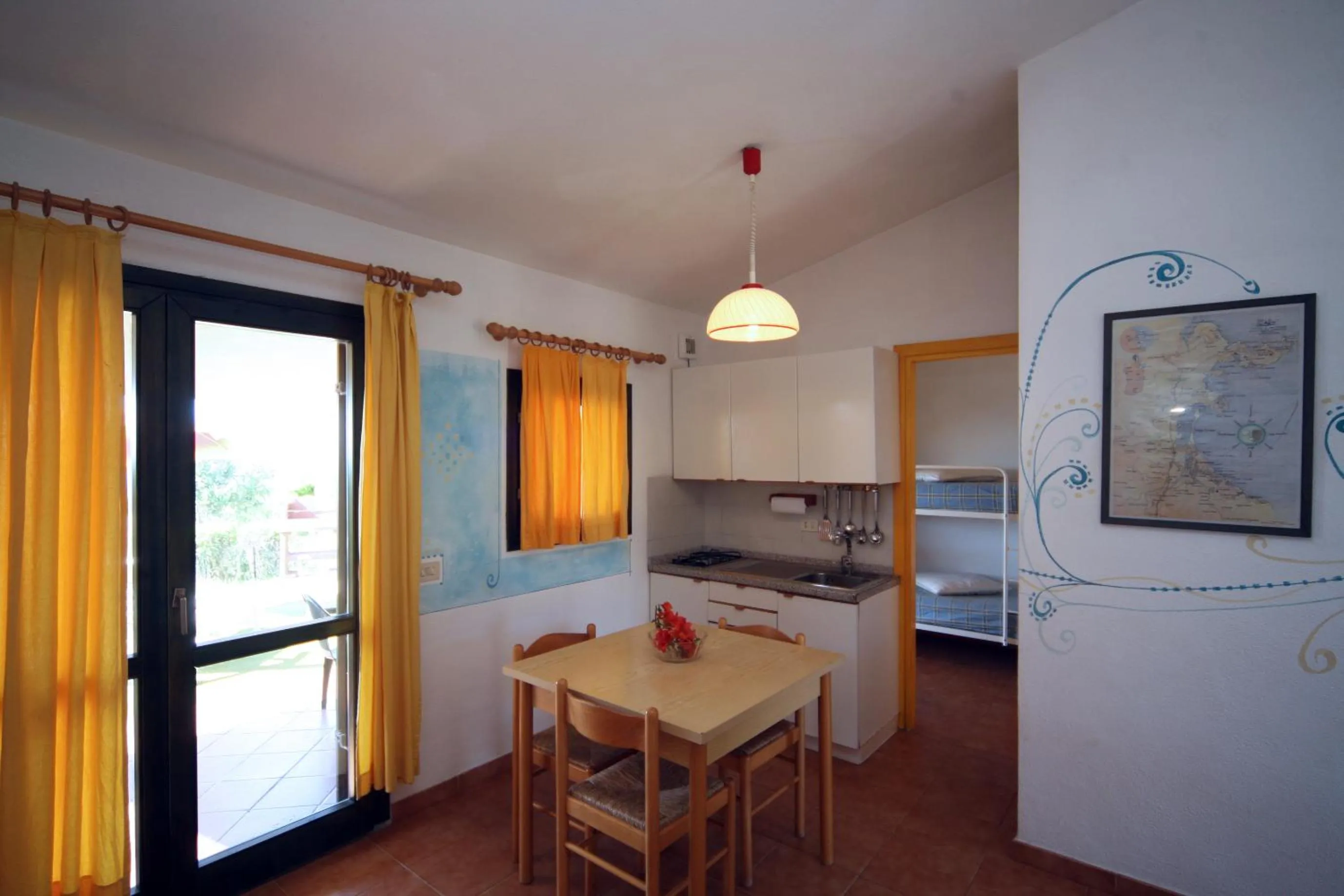 Kitchen or kitchenette in Residence Baia Salinedda