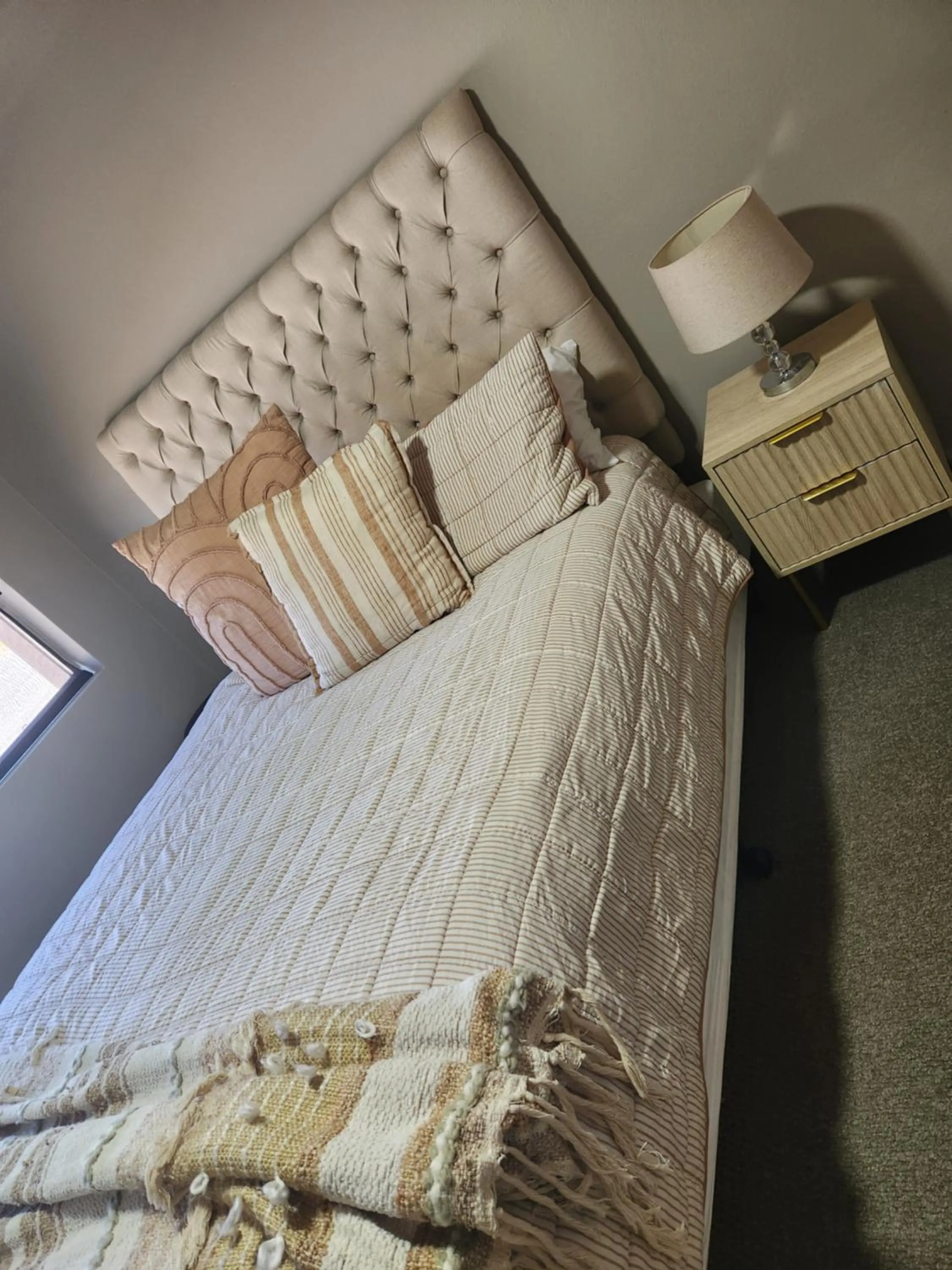 Bed in Kindred Studio Apartments