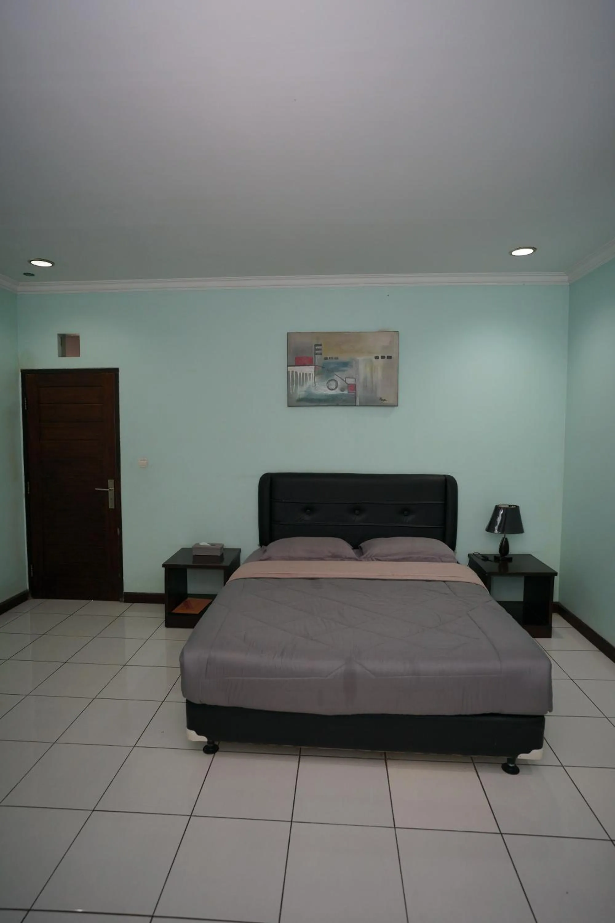 Bed in Hotel Puri Pangalengan