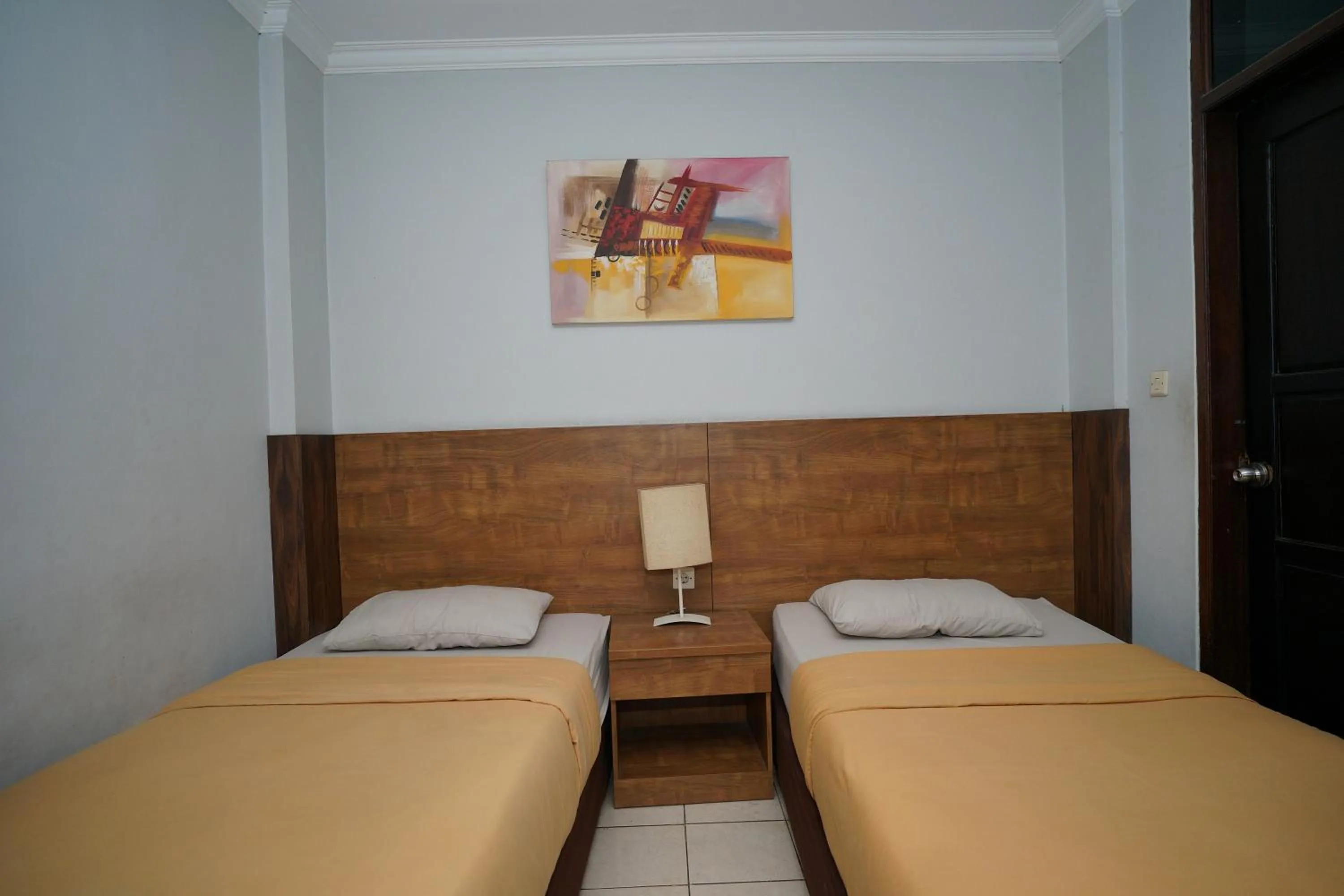 Bed in Hotel Puri Pangalengan