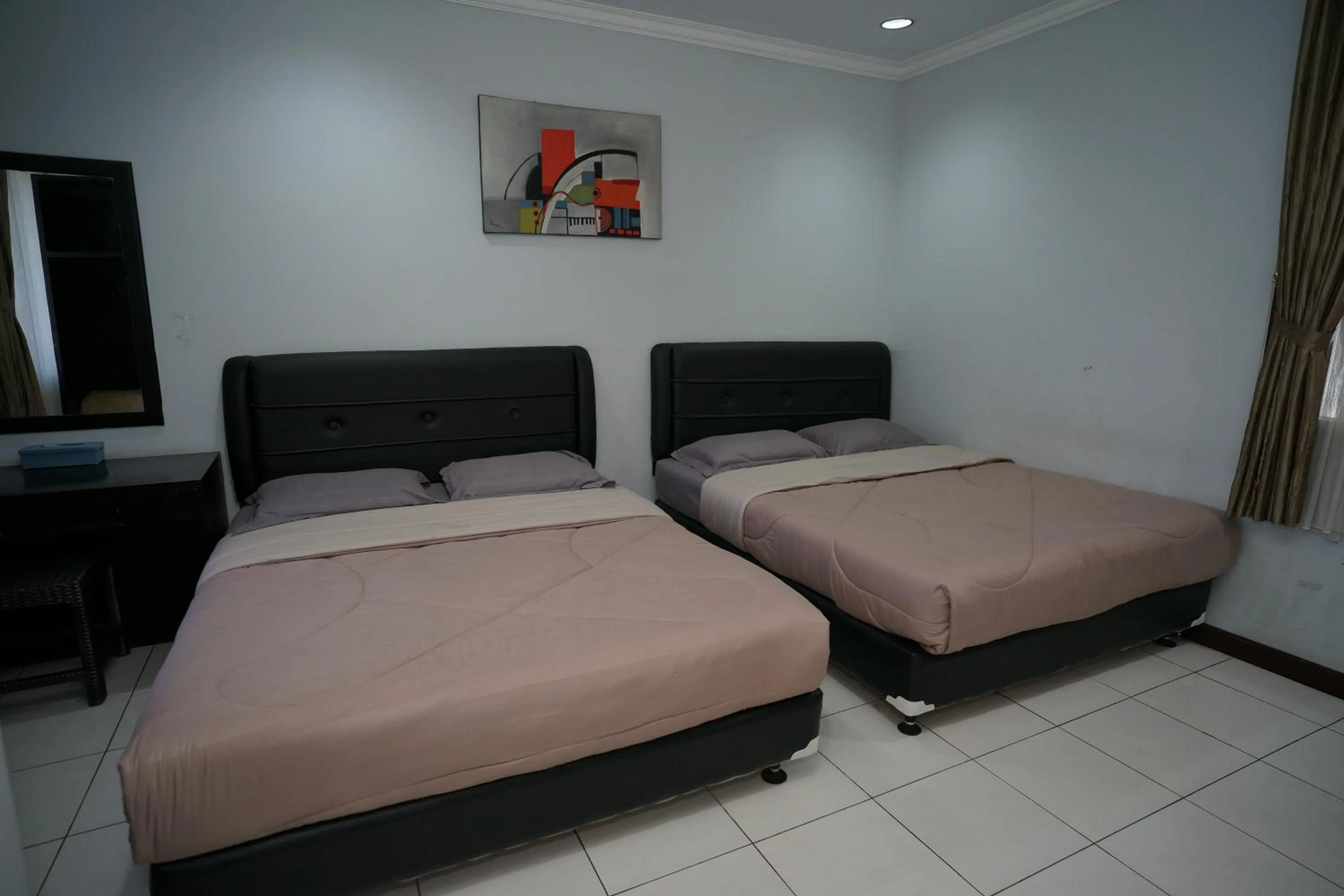 Bed in Hotel Puri Pangalengan