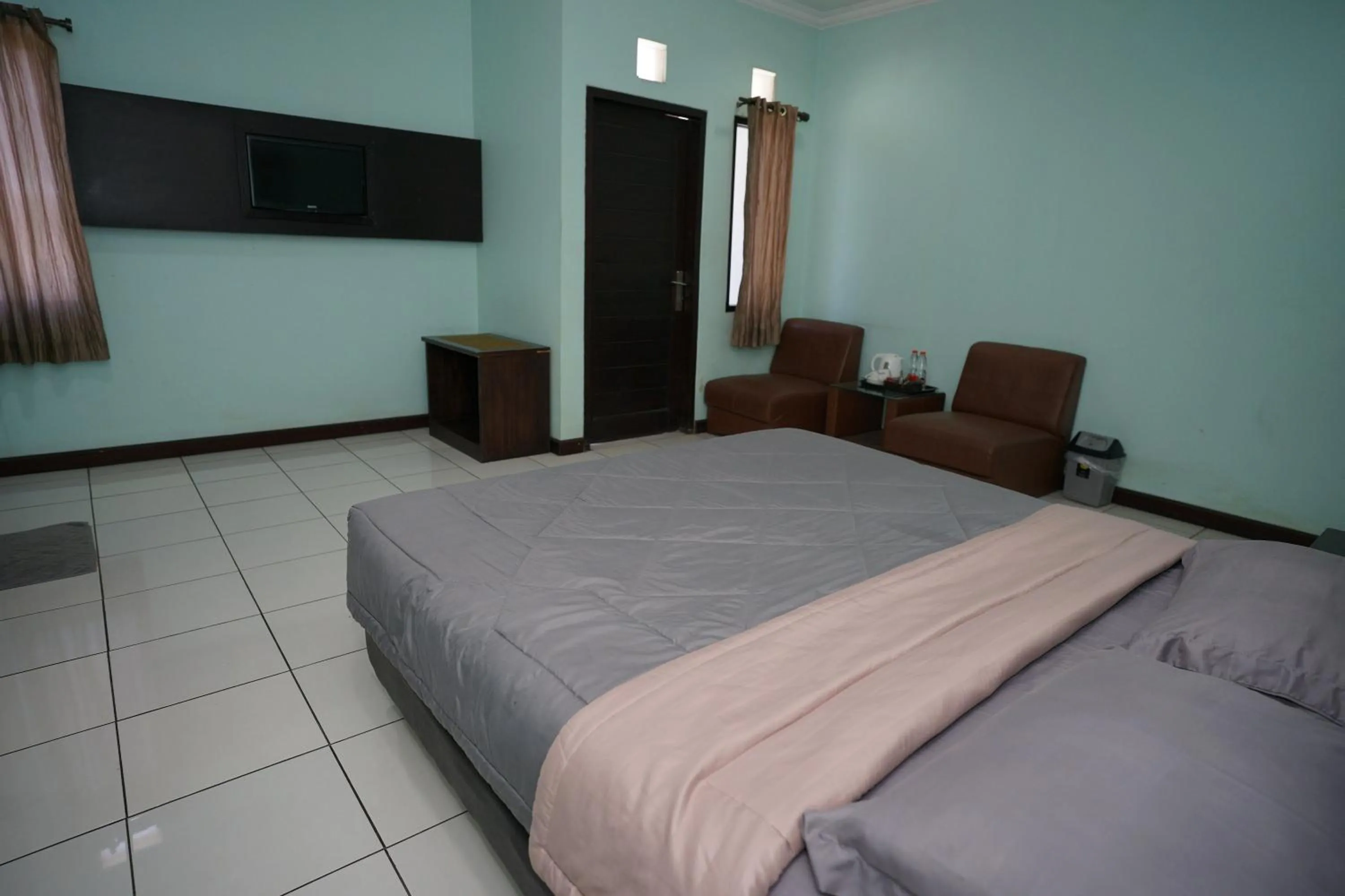 Bed in Hotel Puri Pangalengan