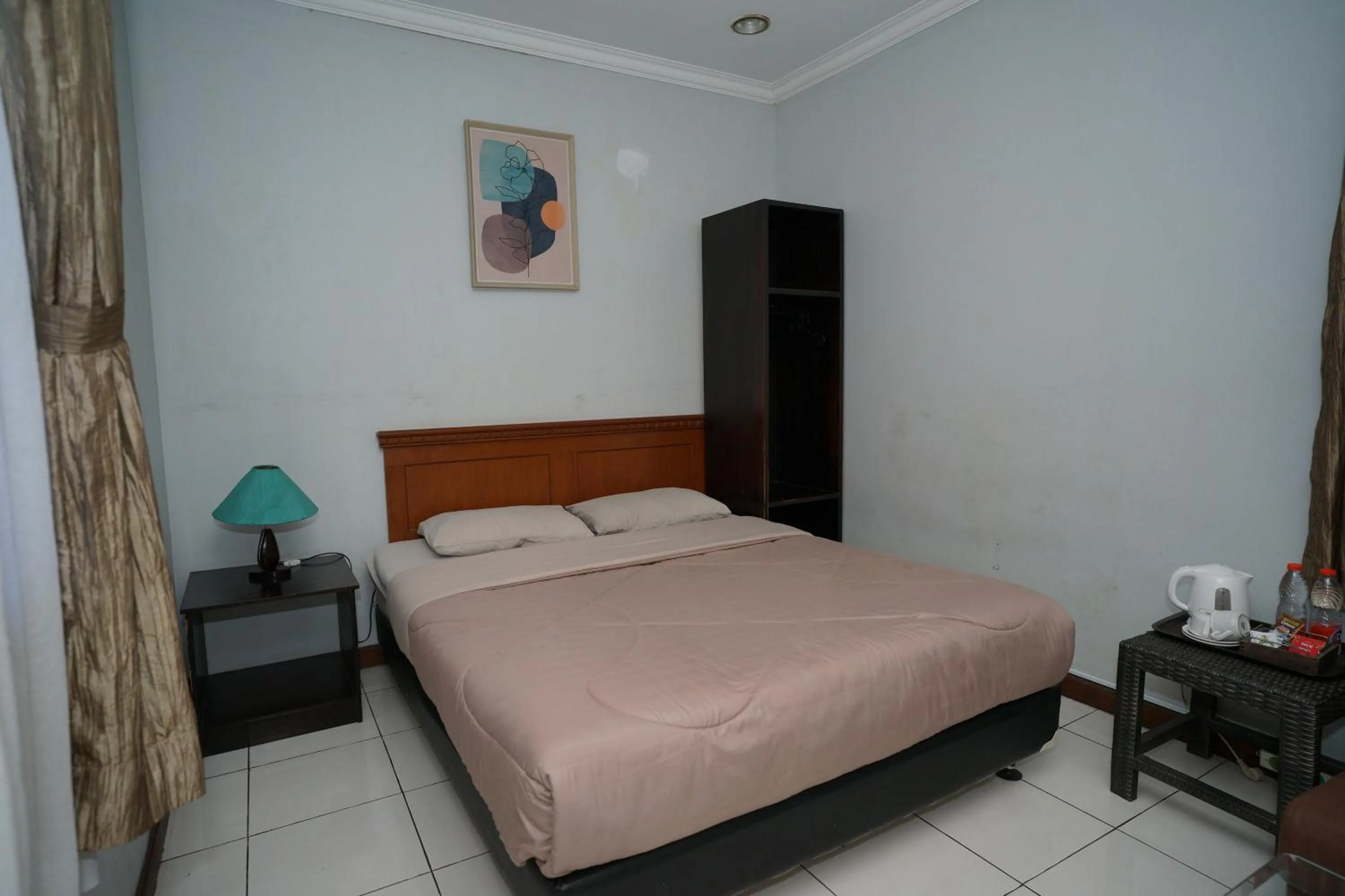 Bed in Hotel Puri Pangalengan