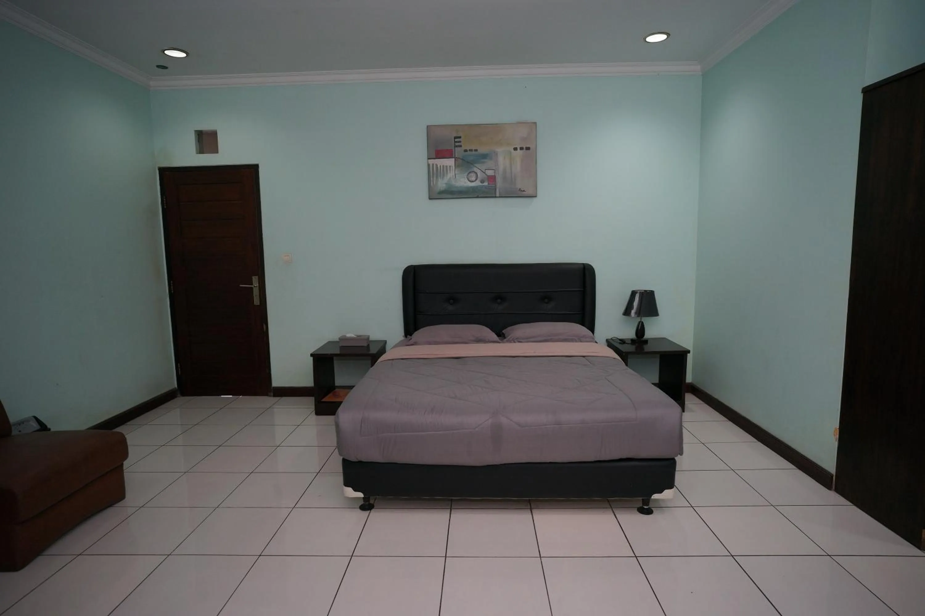 Bed in Hotel Puri Pangalengan