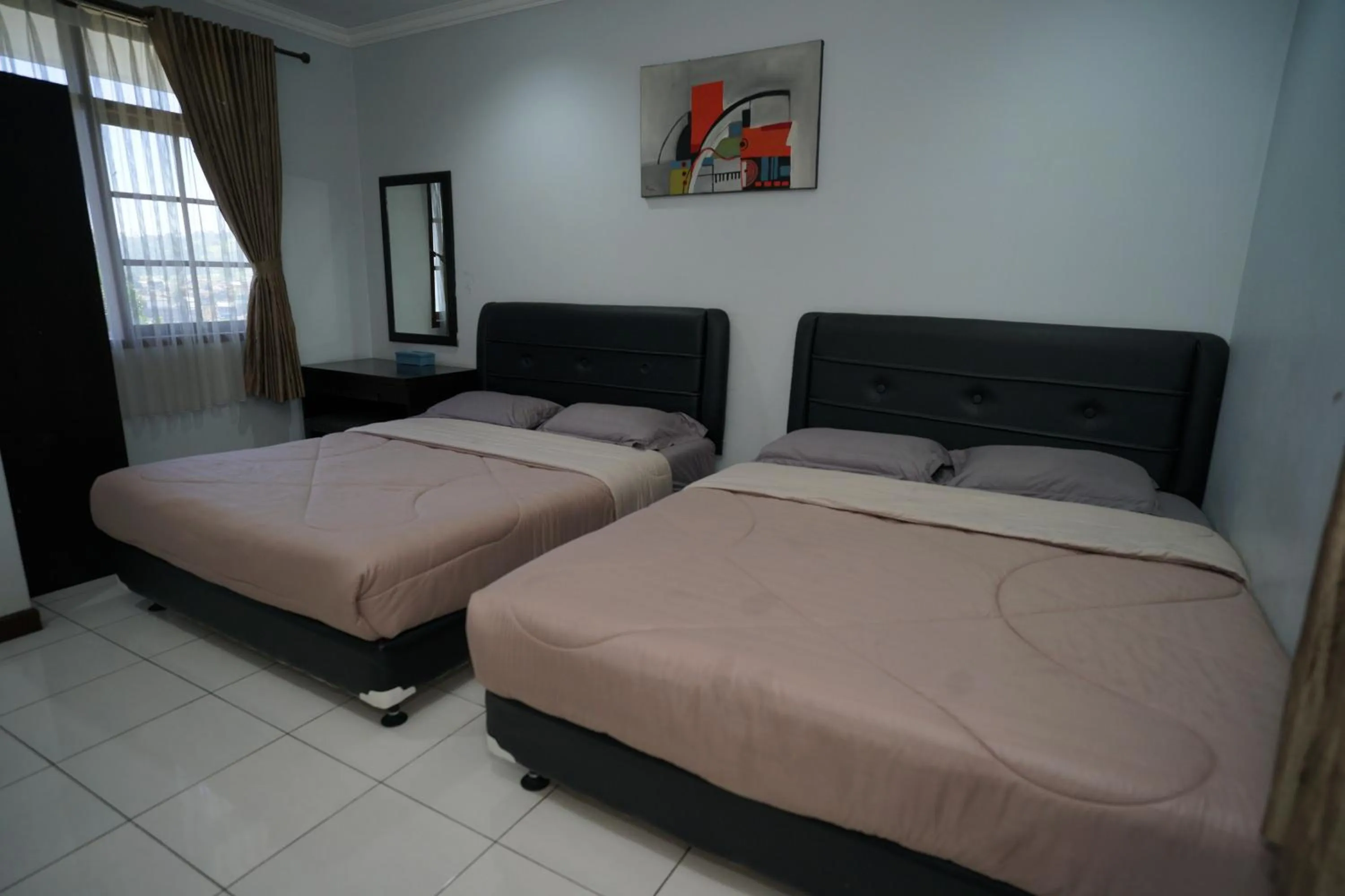 Bed in Hotel Puri Pangalengan