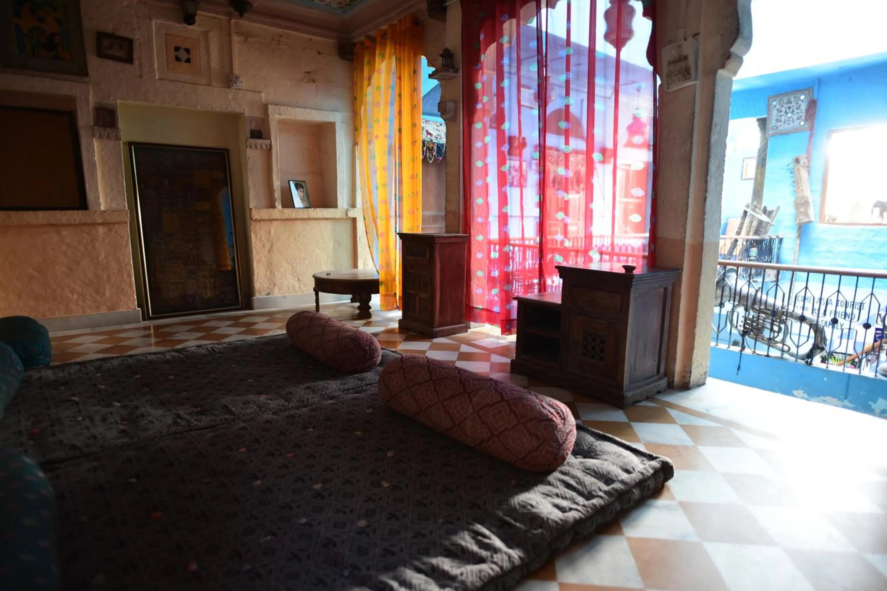 Seating area, Bed in Yogis Guest House