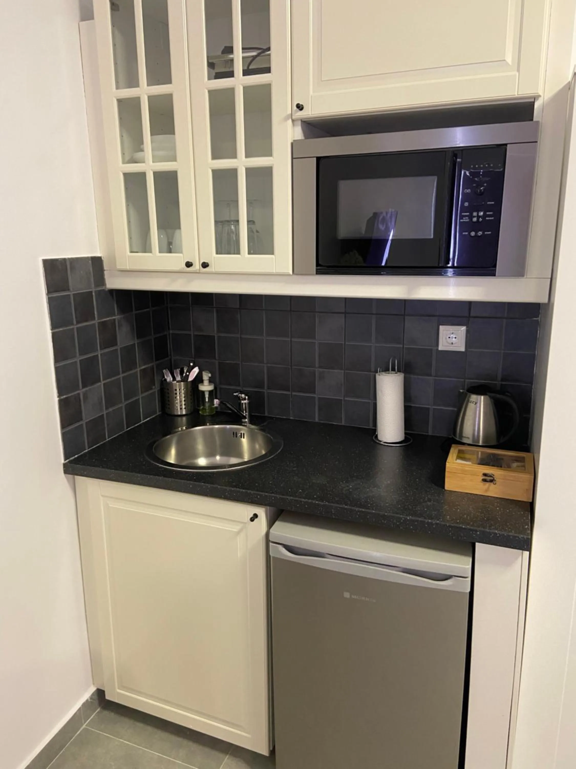 Kitchen or kitchenette in Connect Suites