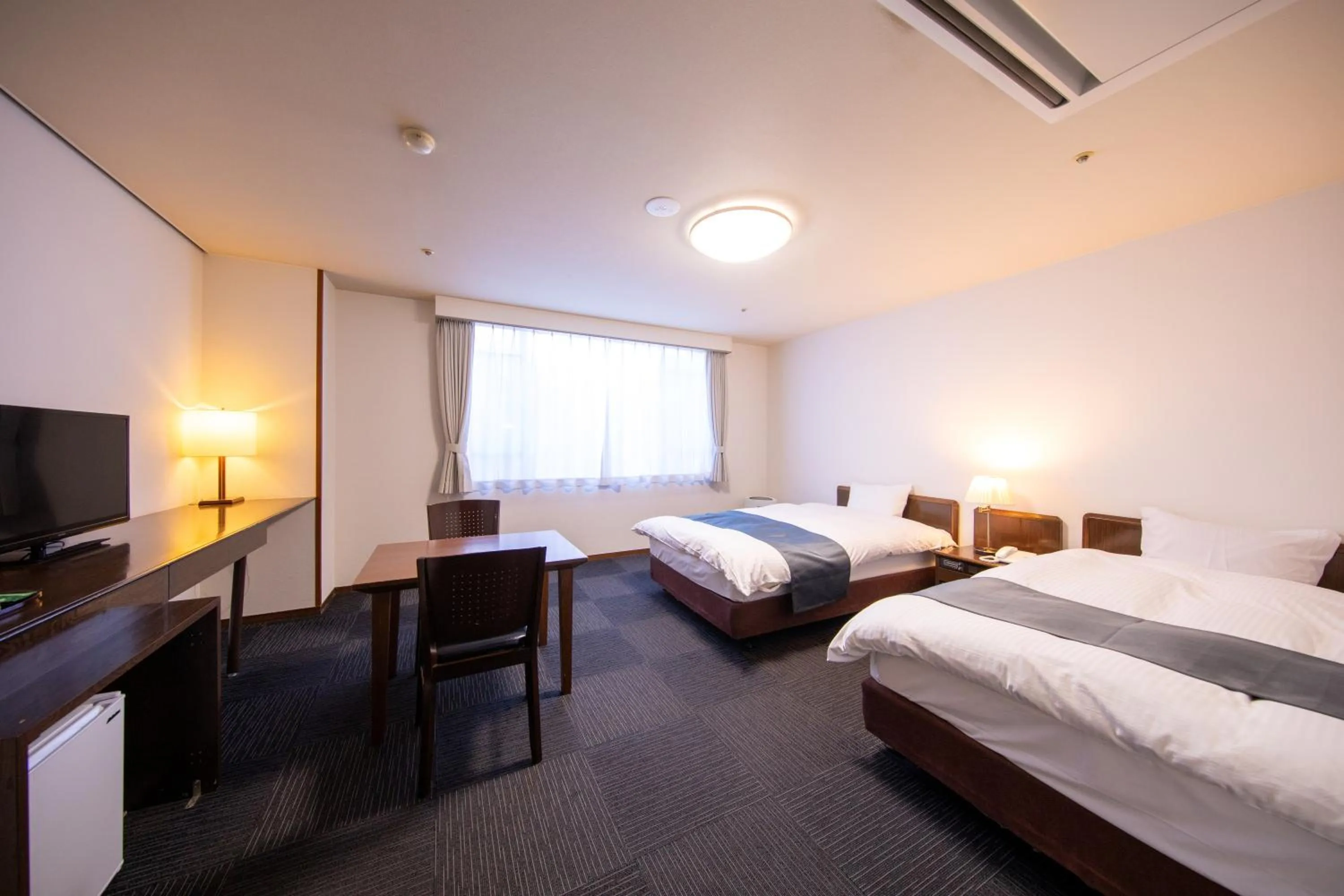 Photo of the whole room, Bed in Yufuin Hotel Shuhokan