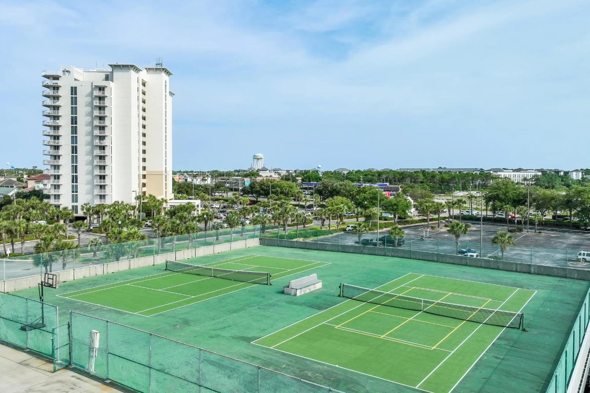 Tennis court in Pelican Beach Resort by Tufan
