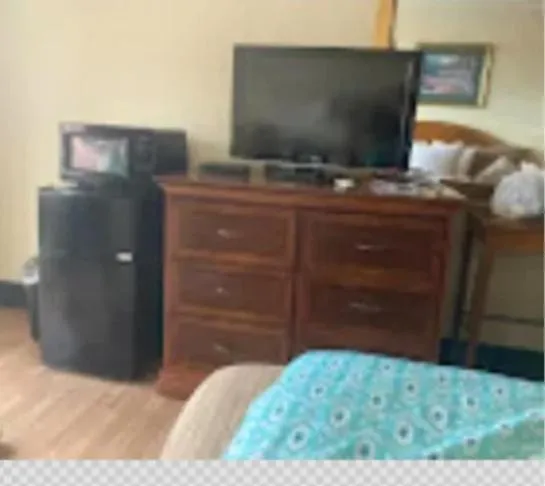 Bed in Daniel Boone Motor Inn