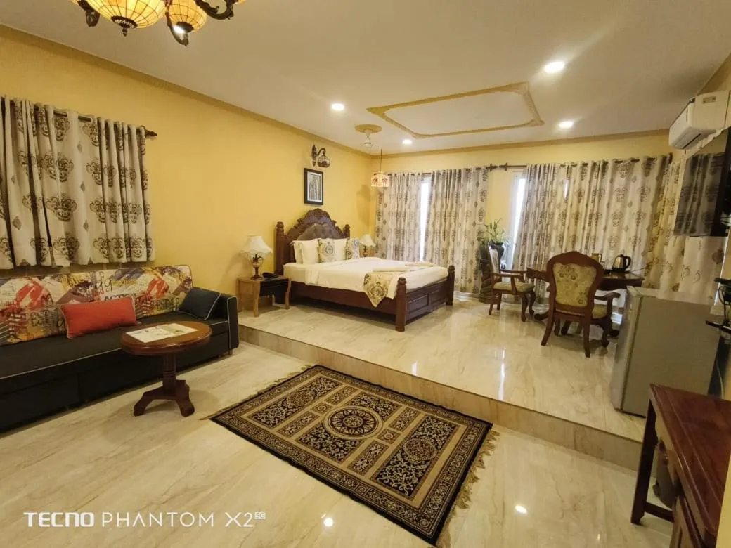 Seating area, Bed in Alcove Resort Vagator