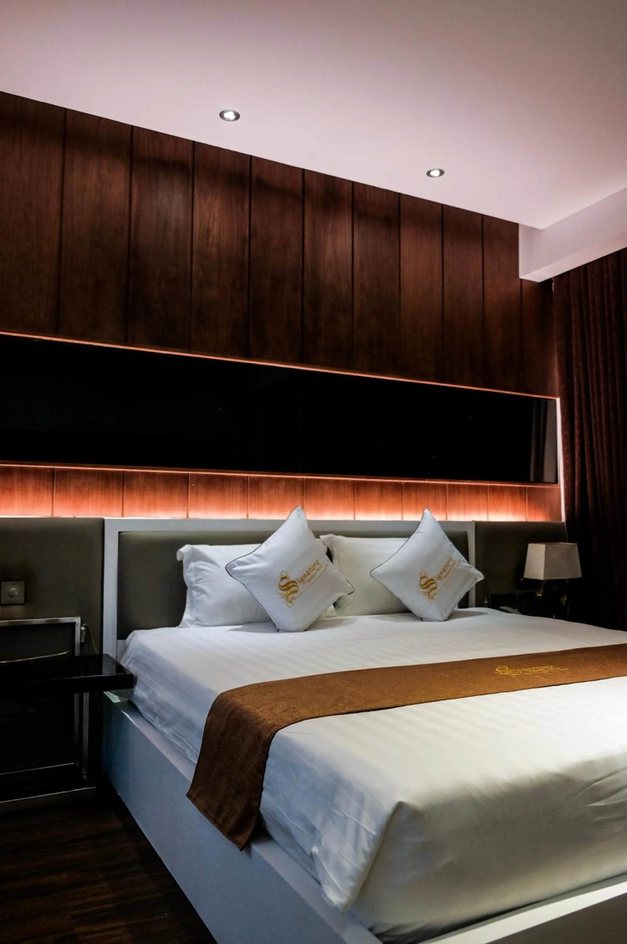 Bed in Signature Boutique Hotel