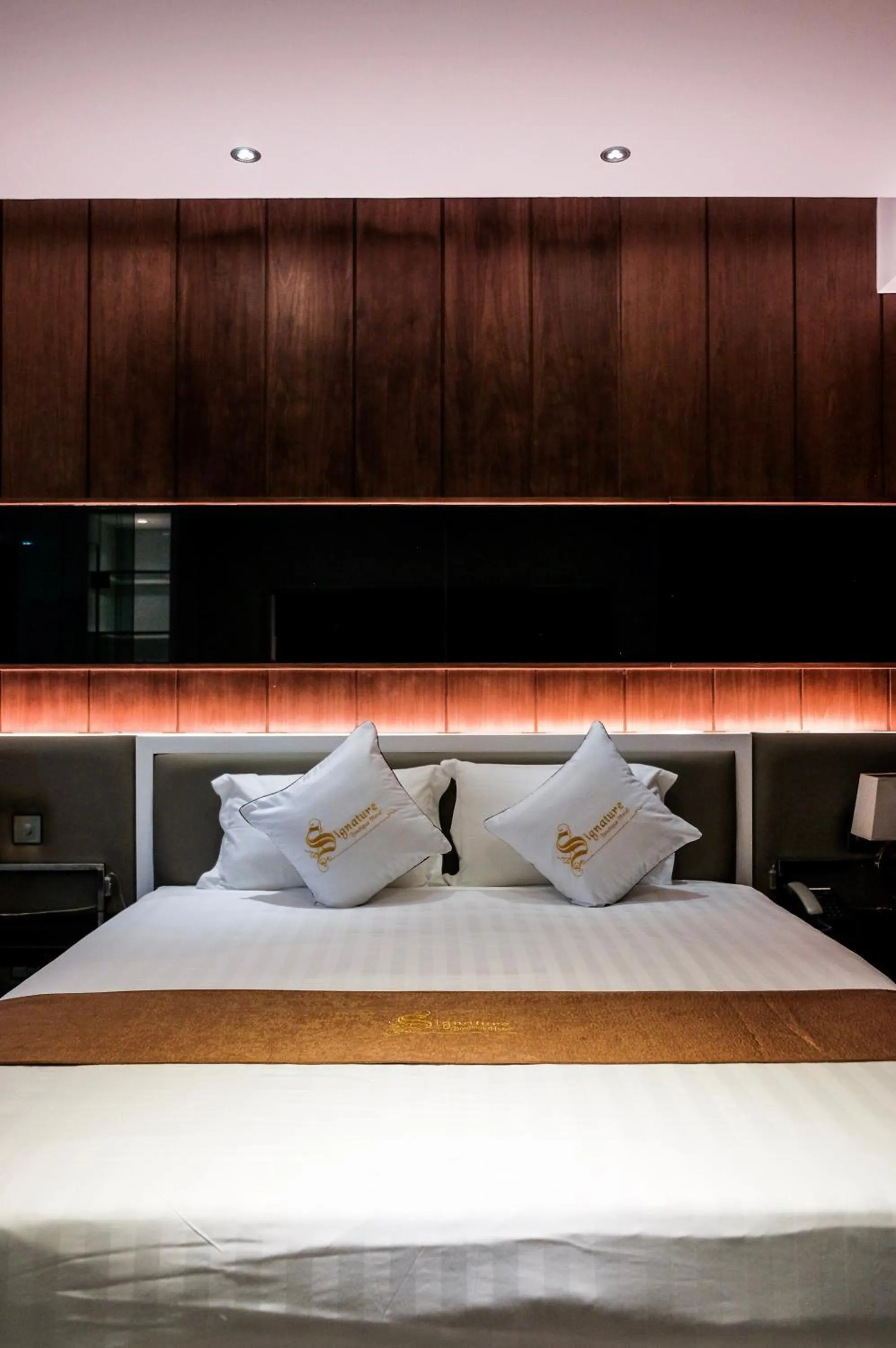 Bed in Signature Boutique Hotel