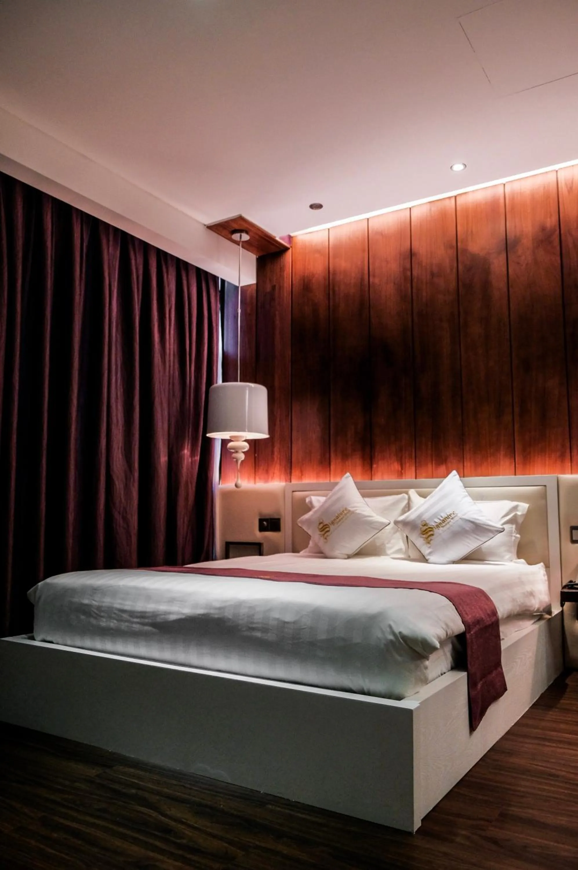 Bed in Signature Boutique Hotel