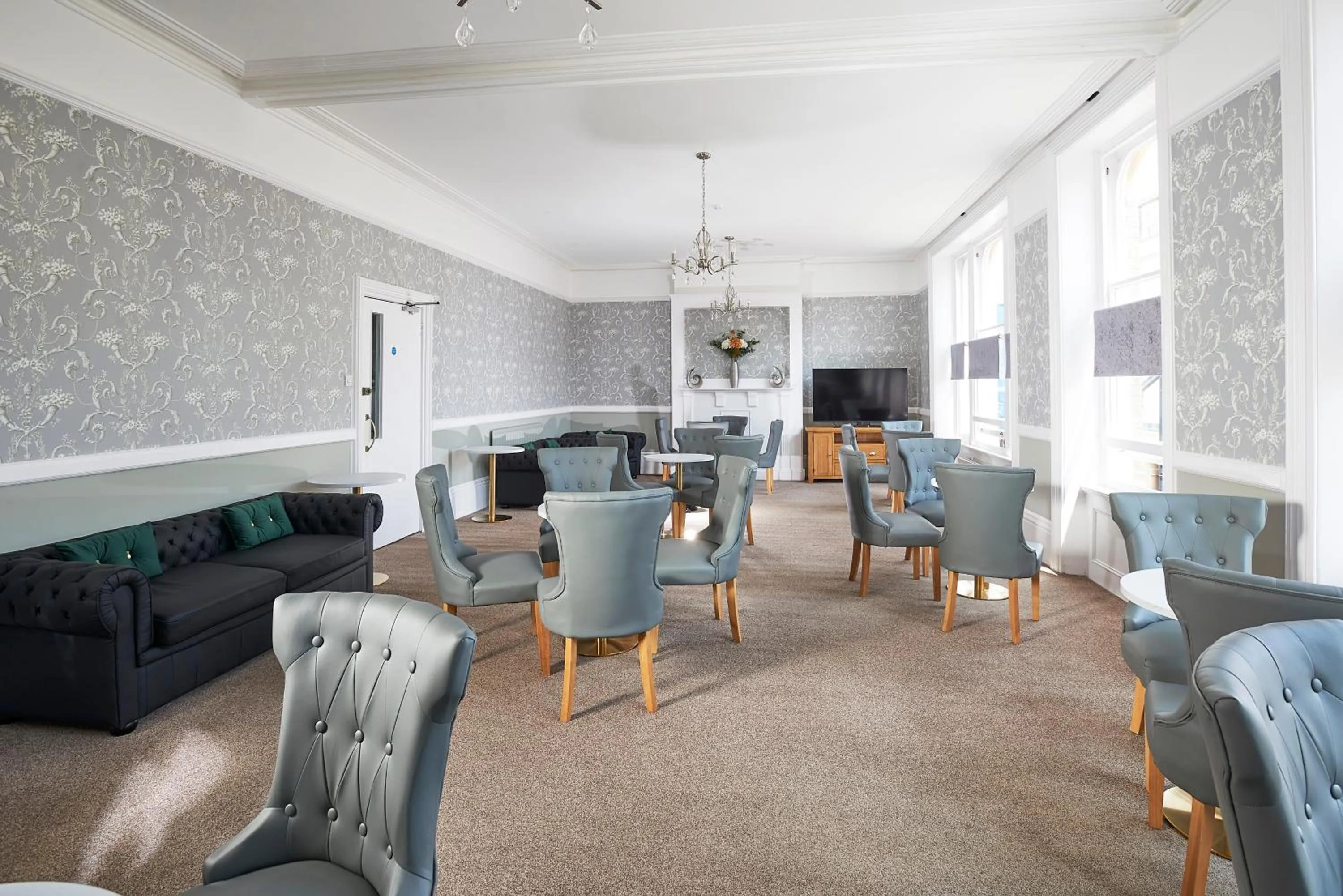 Communal lounge/ TV room in The Crown Hotel