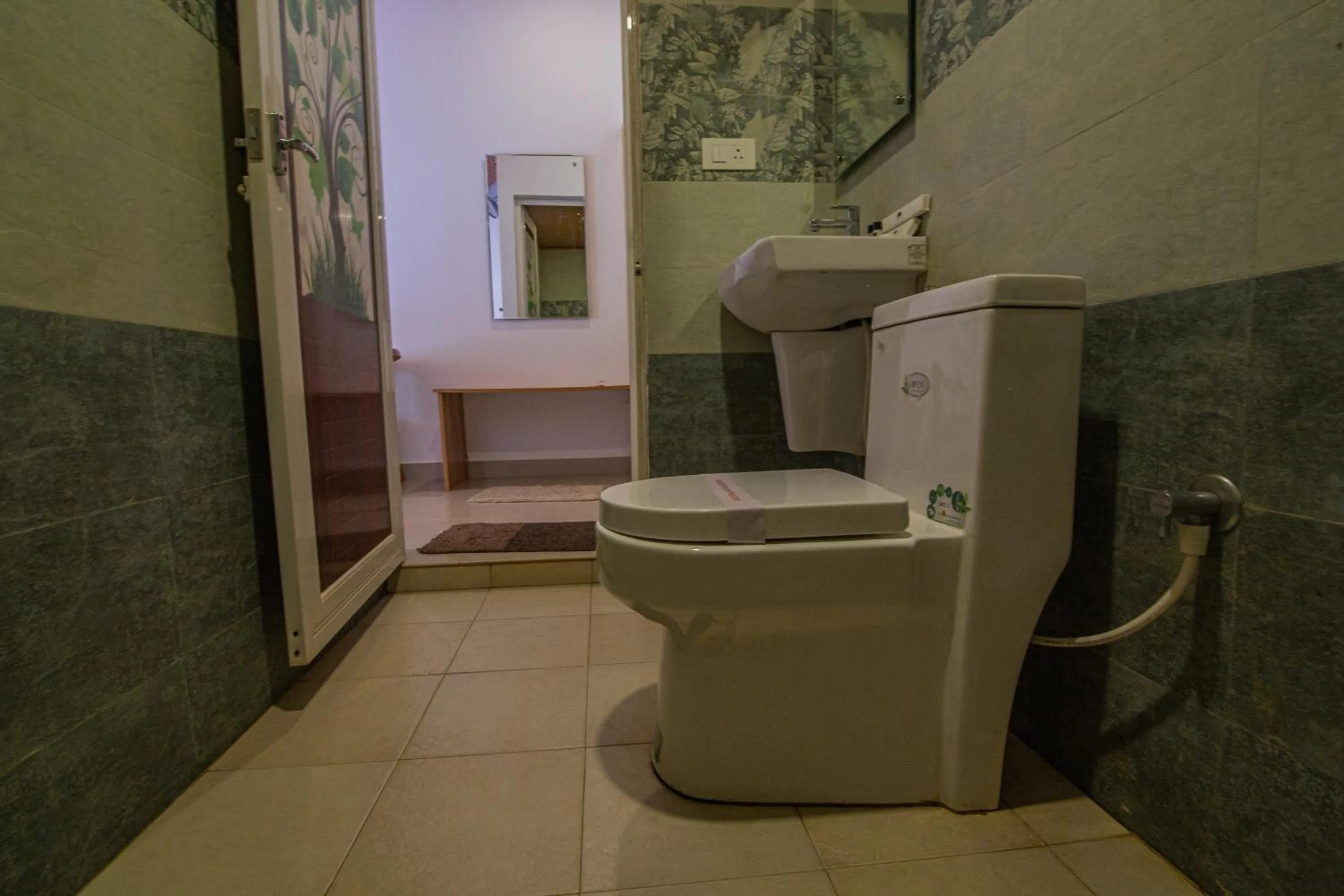 Toilet in Orchid Trails Resort