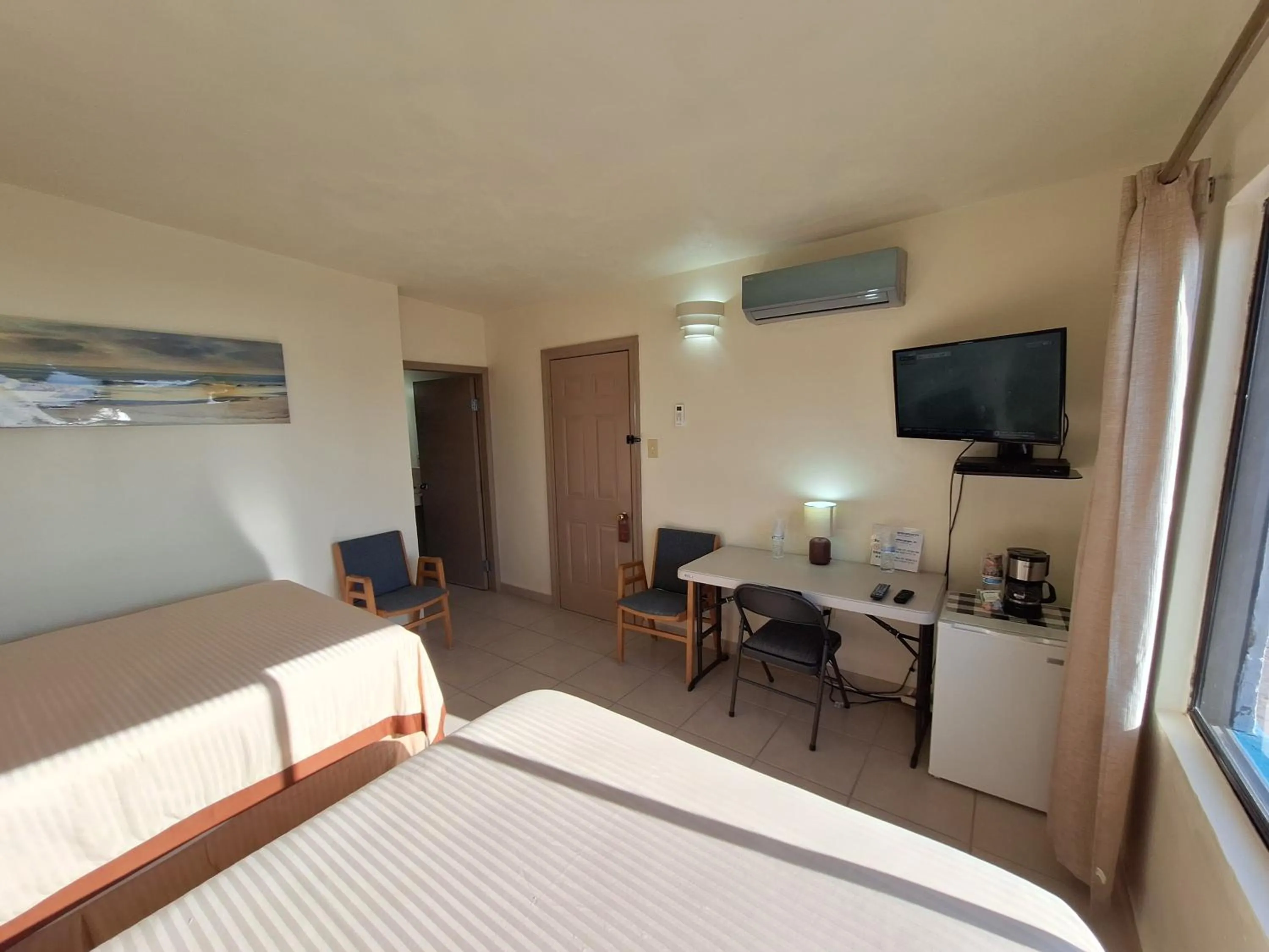 Bed in #53 Bungalow Seaside Hotel & Victors RV Park