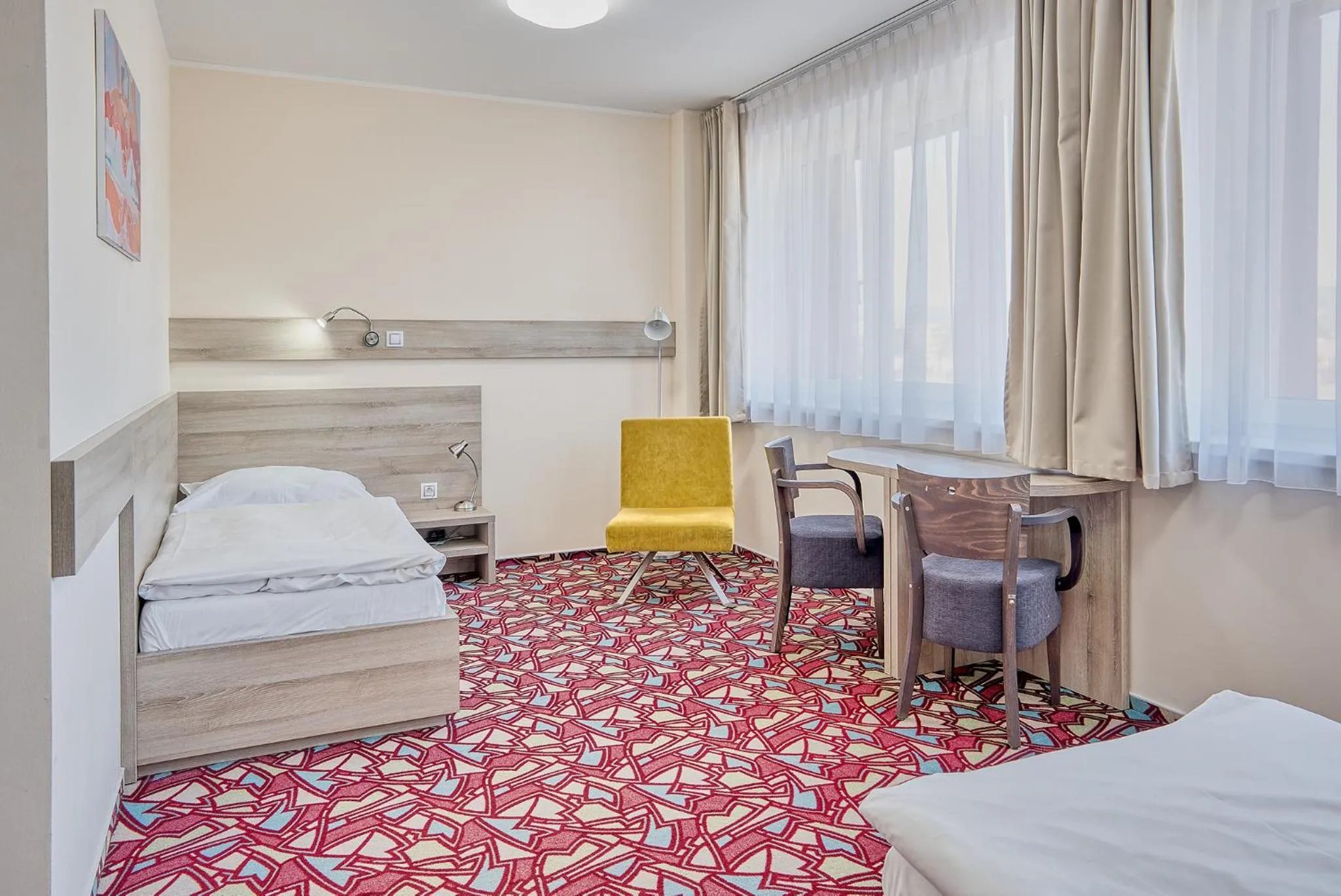 Seating area, Bed in Hotel Arena