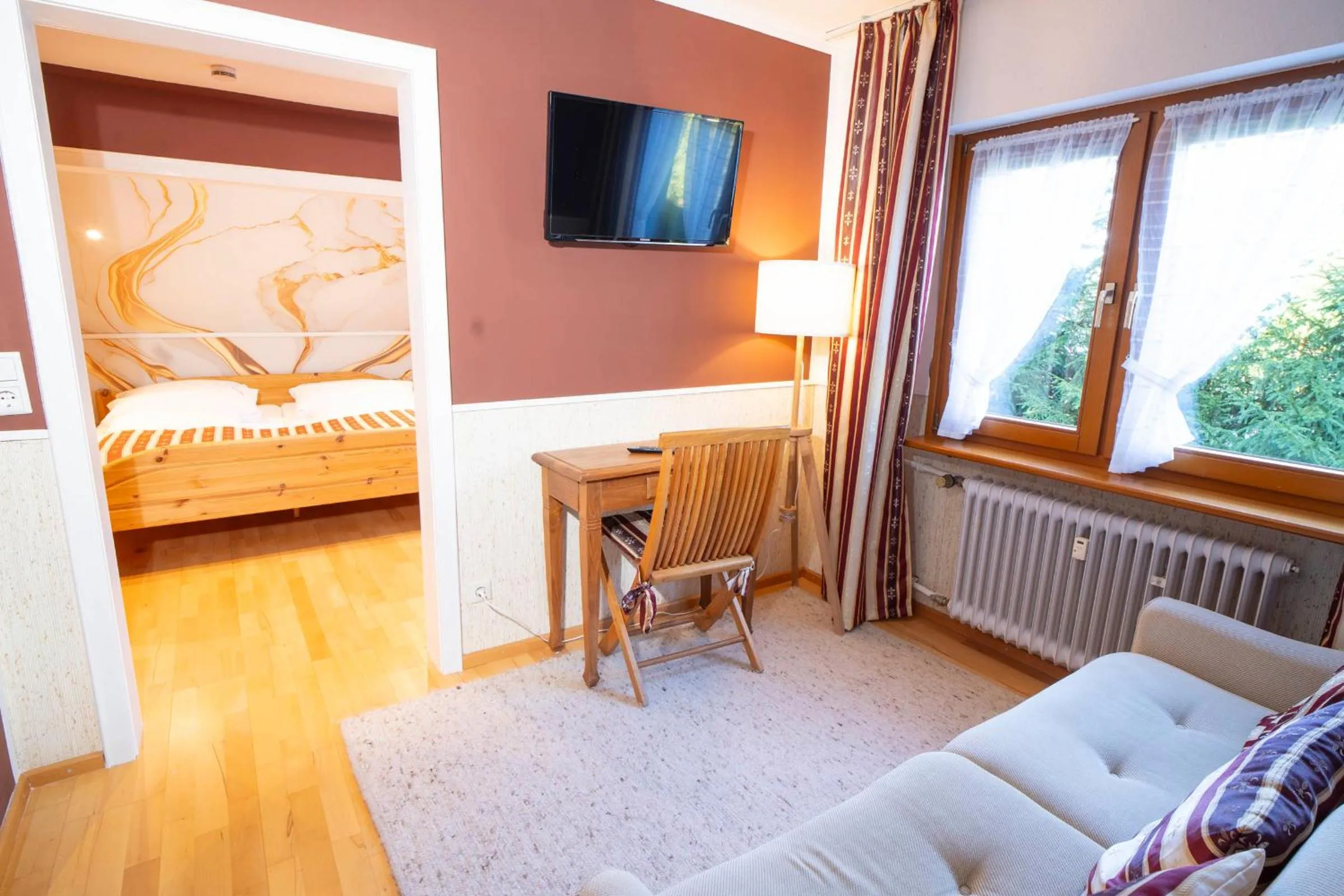 Communal lounge/ TV room, Bed in NATURION Hotel Hinterzarten