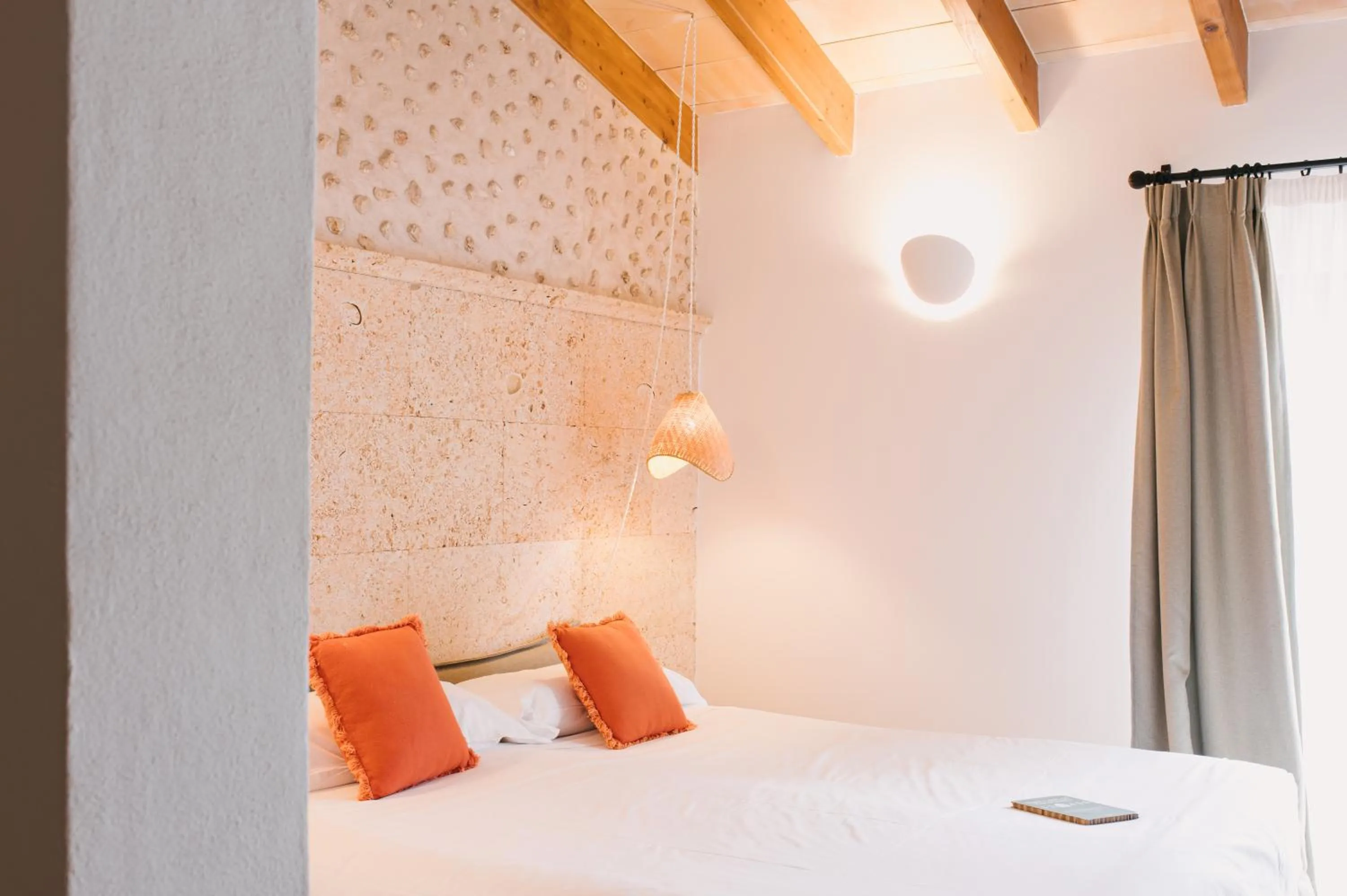 Bed in Curolla Petit Hotel