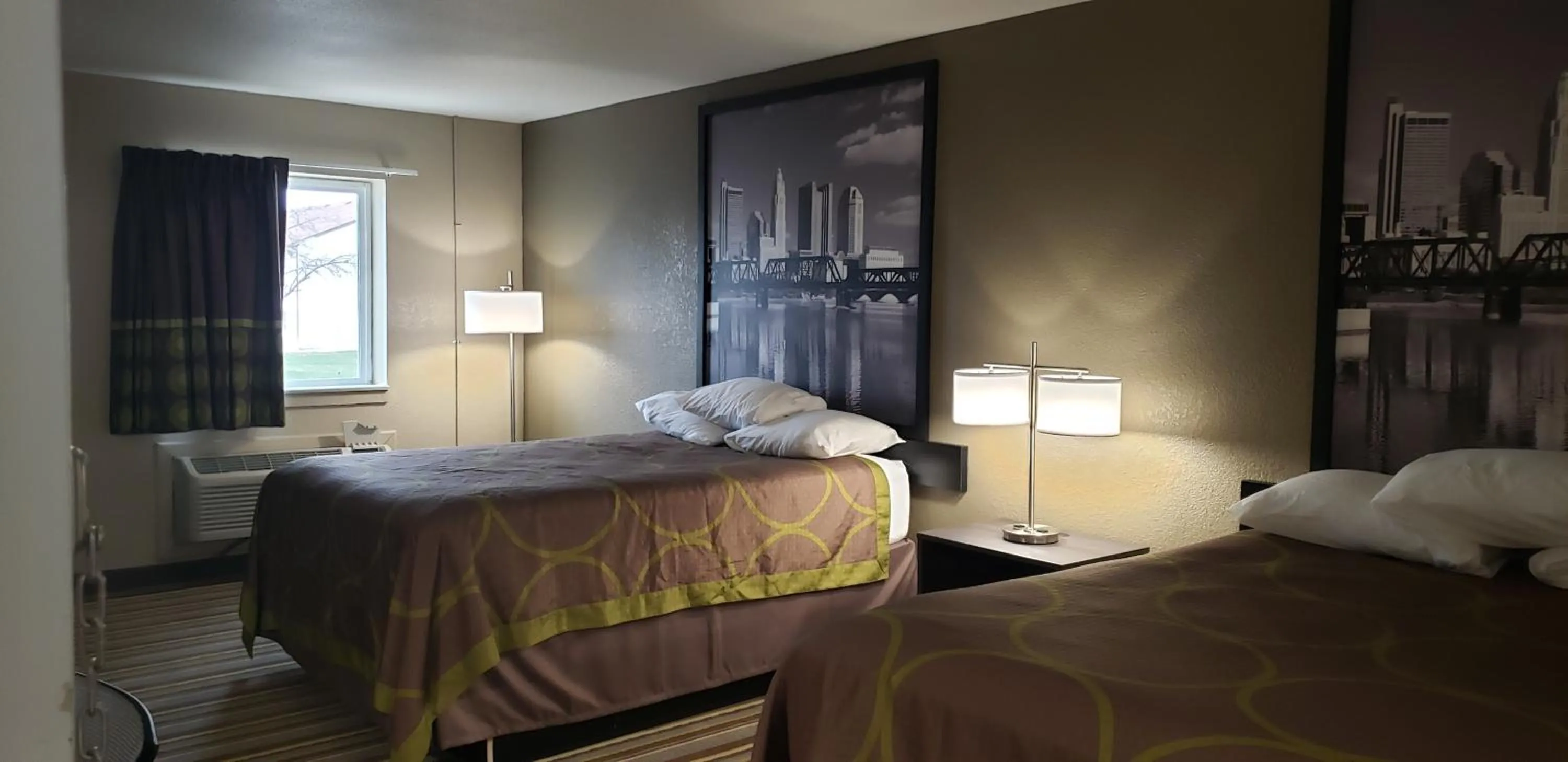 Photo of the whole room, Bed in Travel Inn Of Sidney Ohio