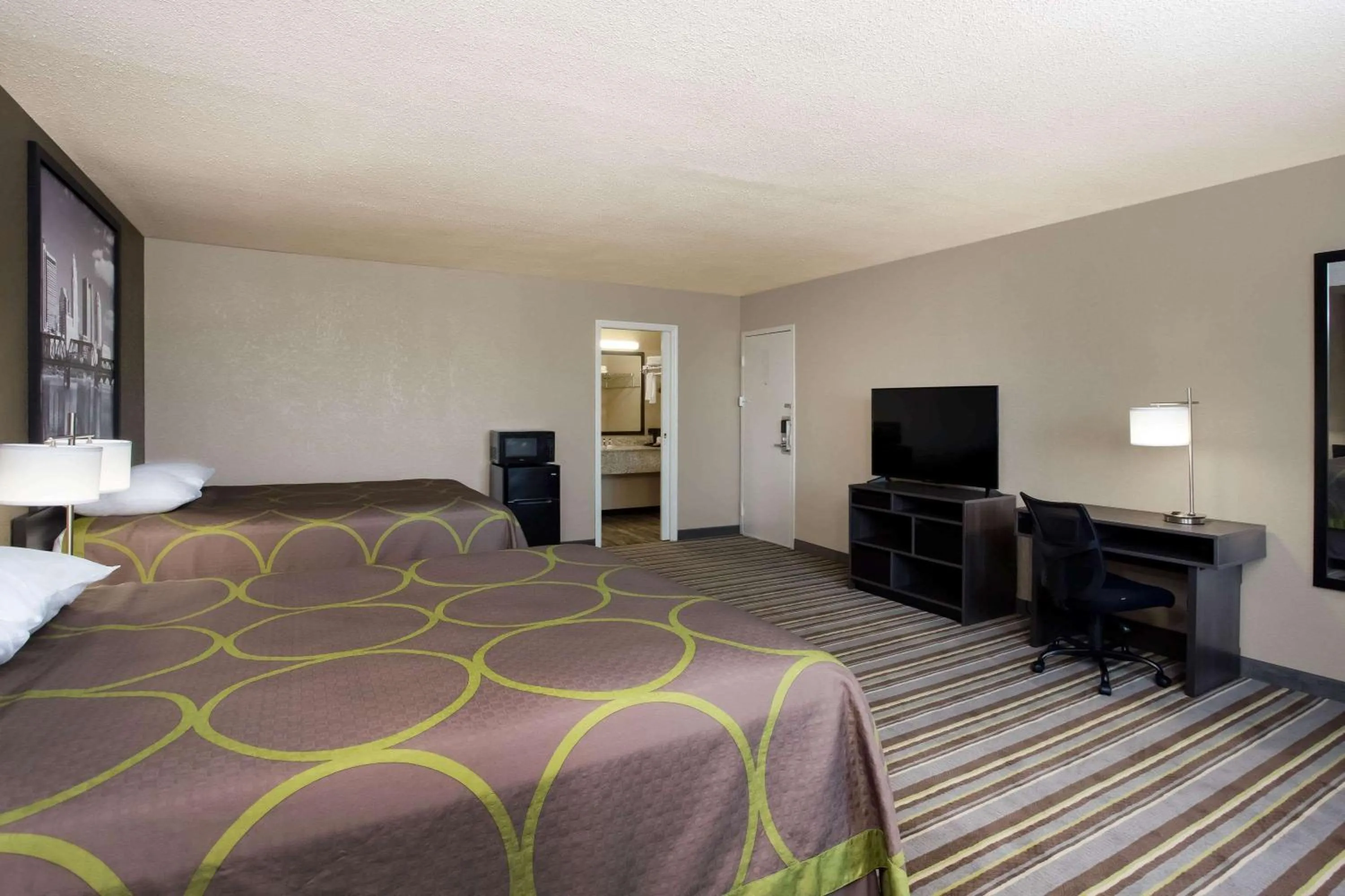 Photo of the whole room, Bed in Travel Inn Of Sidney Ohio