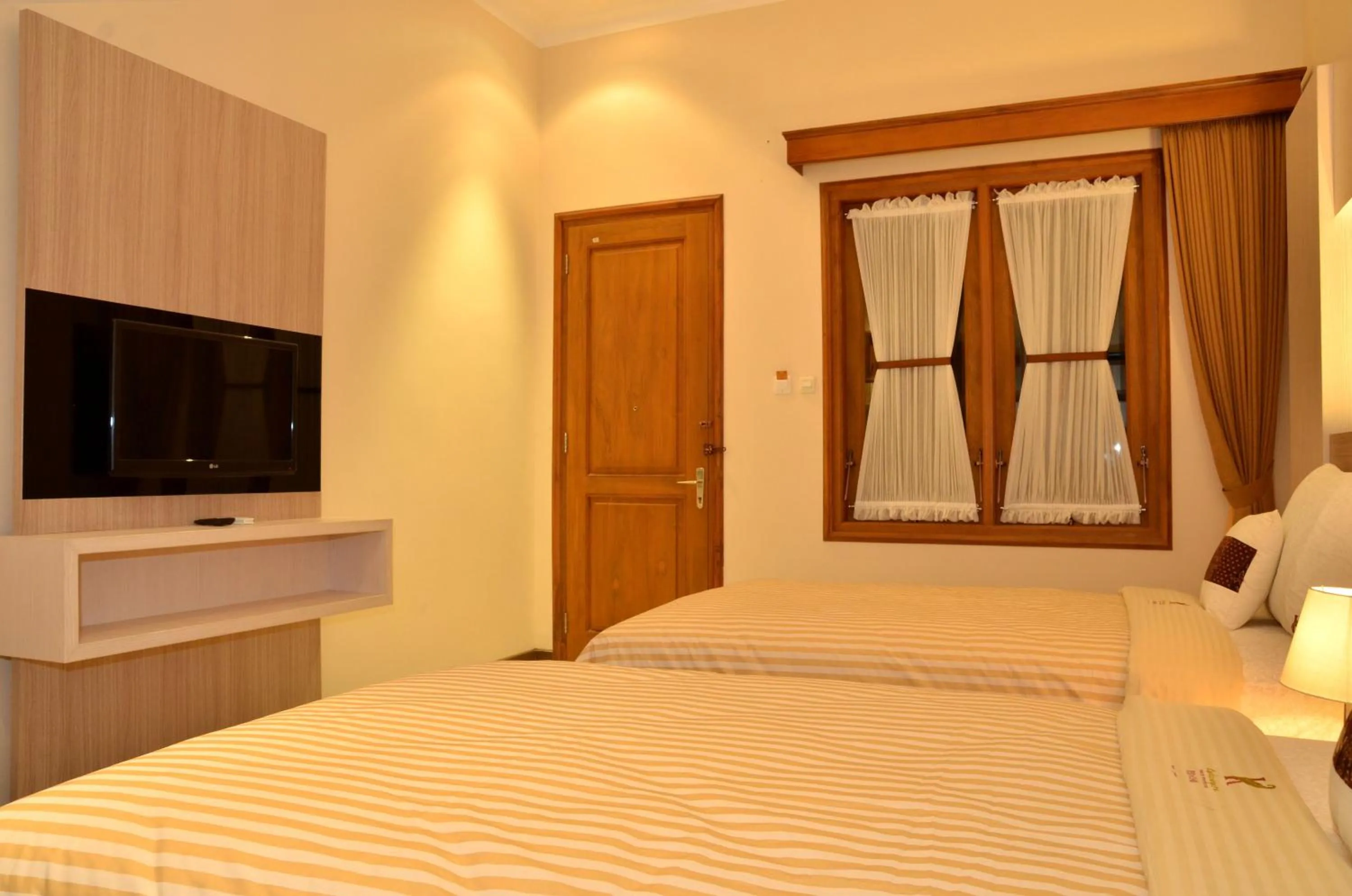Bed in Kertanegara Premium Guest House