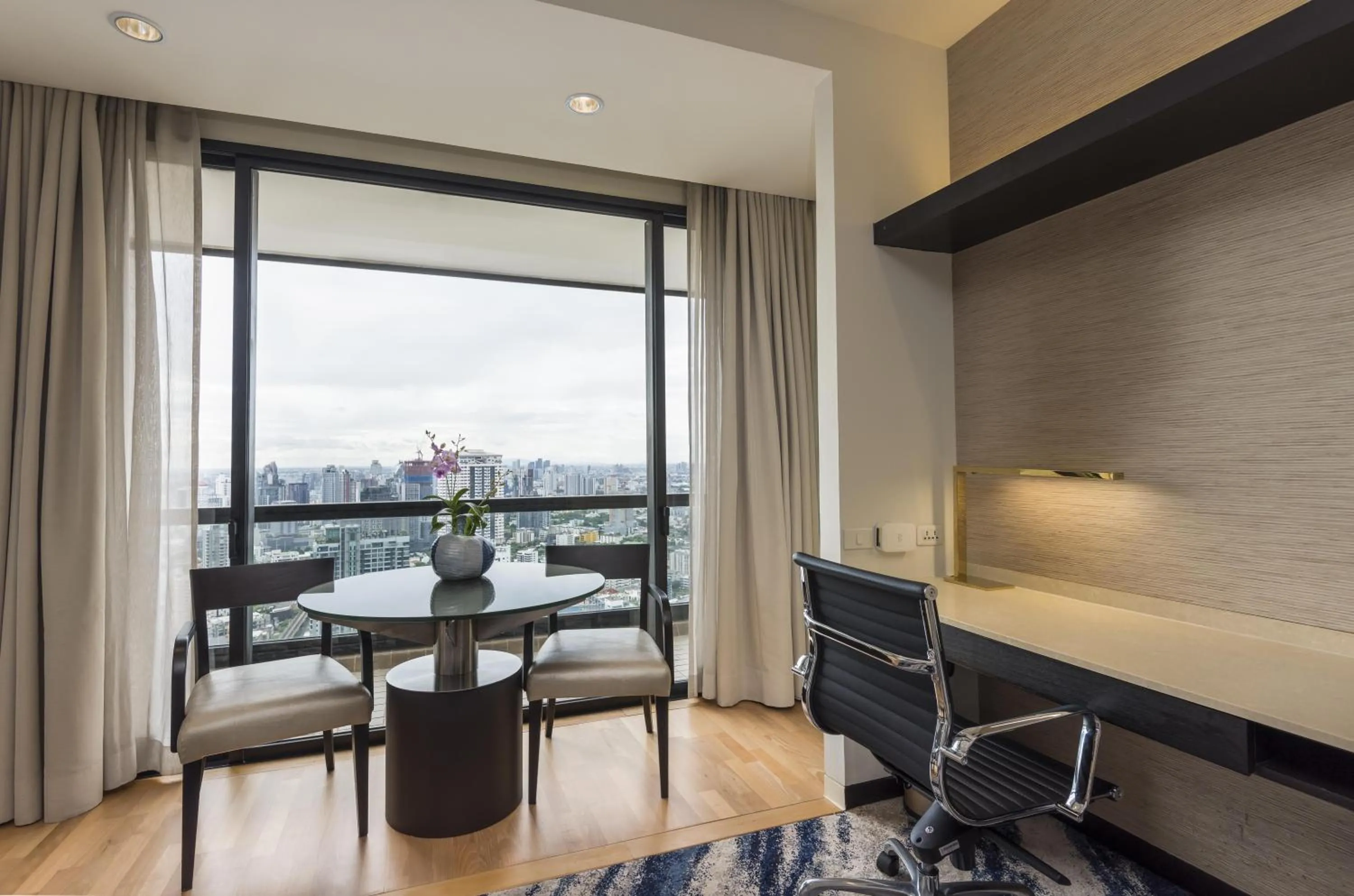 Seating area in Emporium Suites by Chatrium