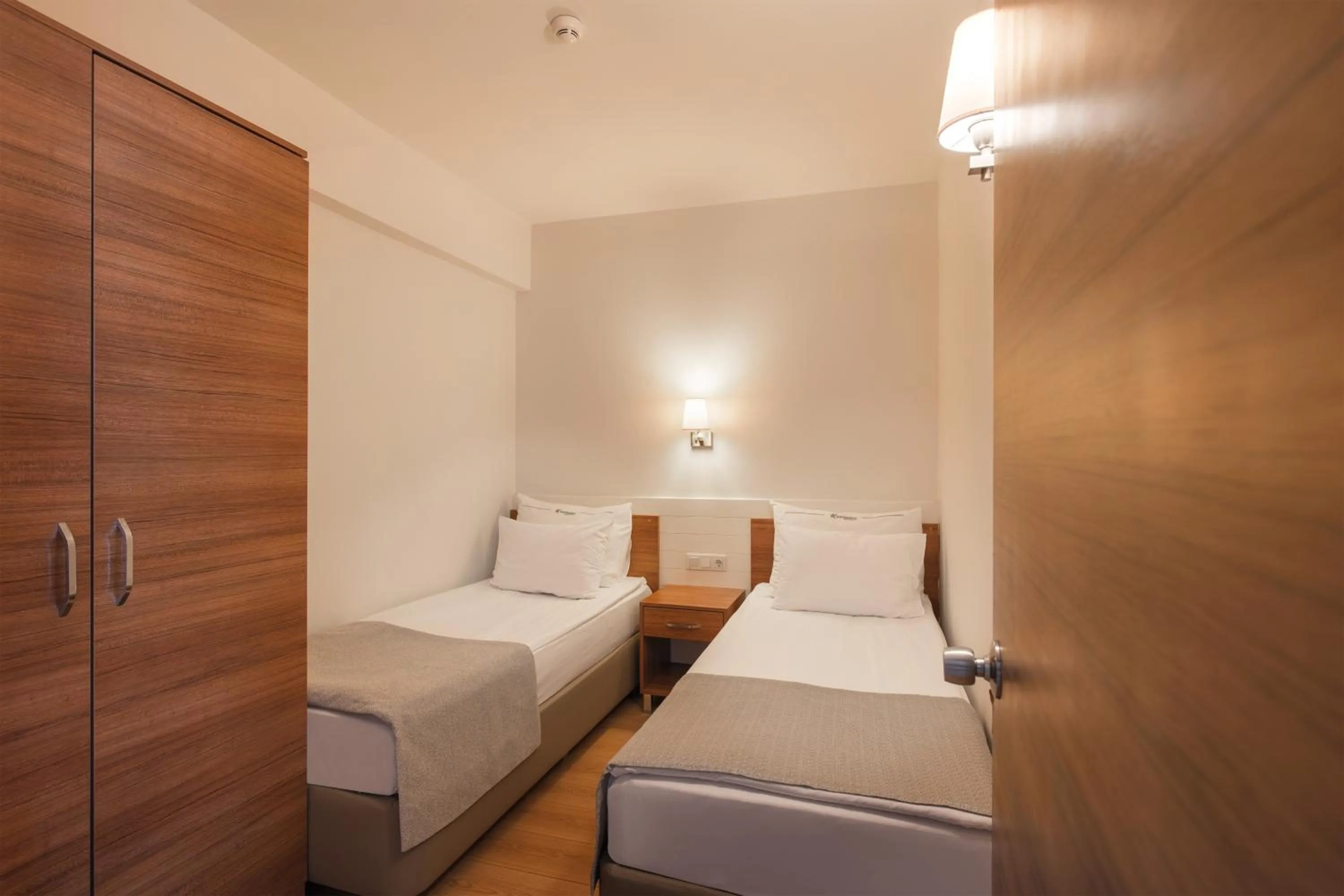 Bed in Grand Park Lara Hotel