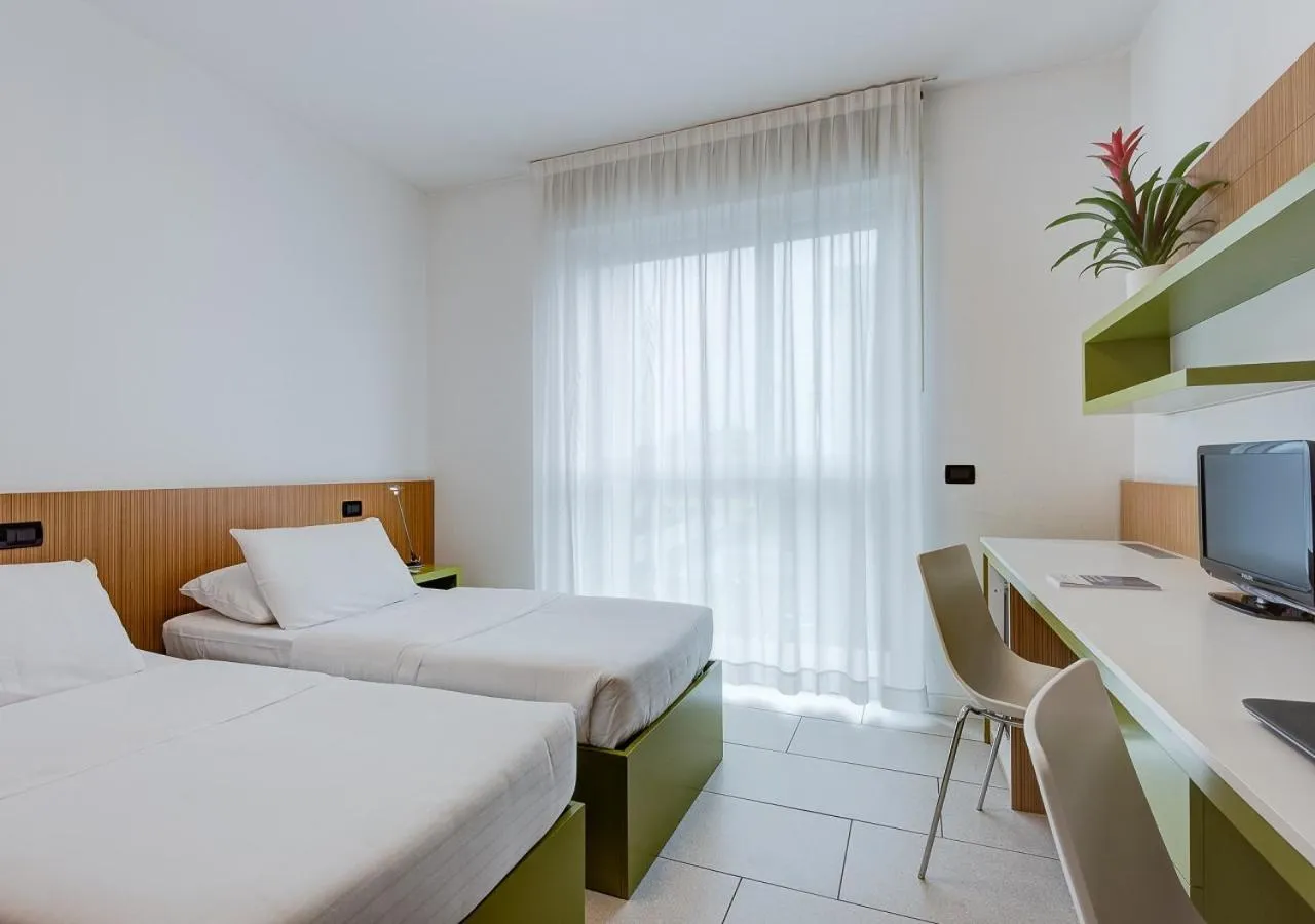 Communal lounge/ TV room, Bed in Camplus Turro Casa per Ferie