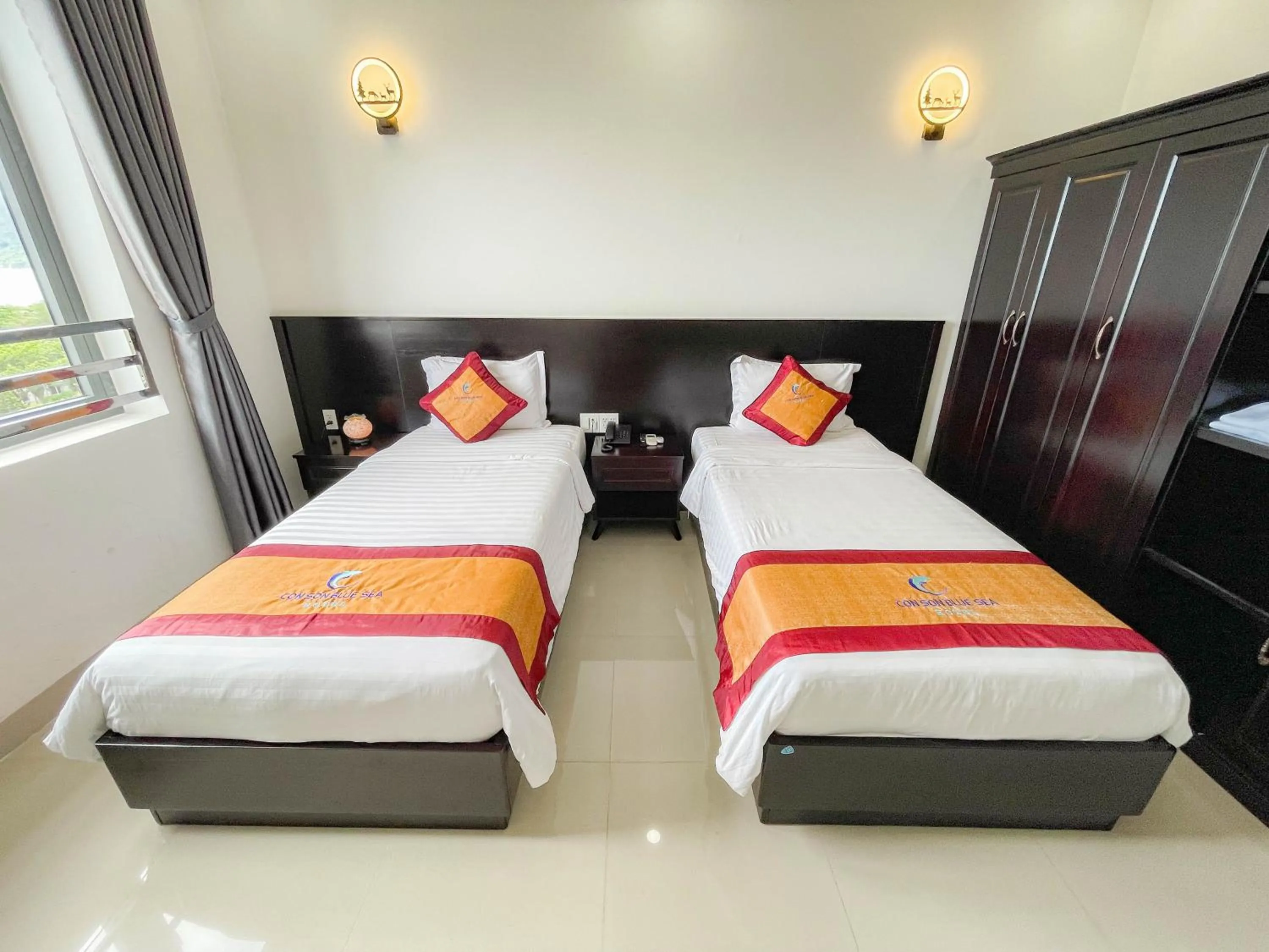 Bed in Con Son Blue Sea Hotel