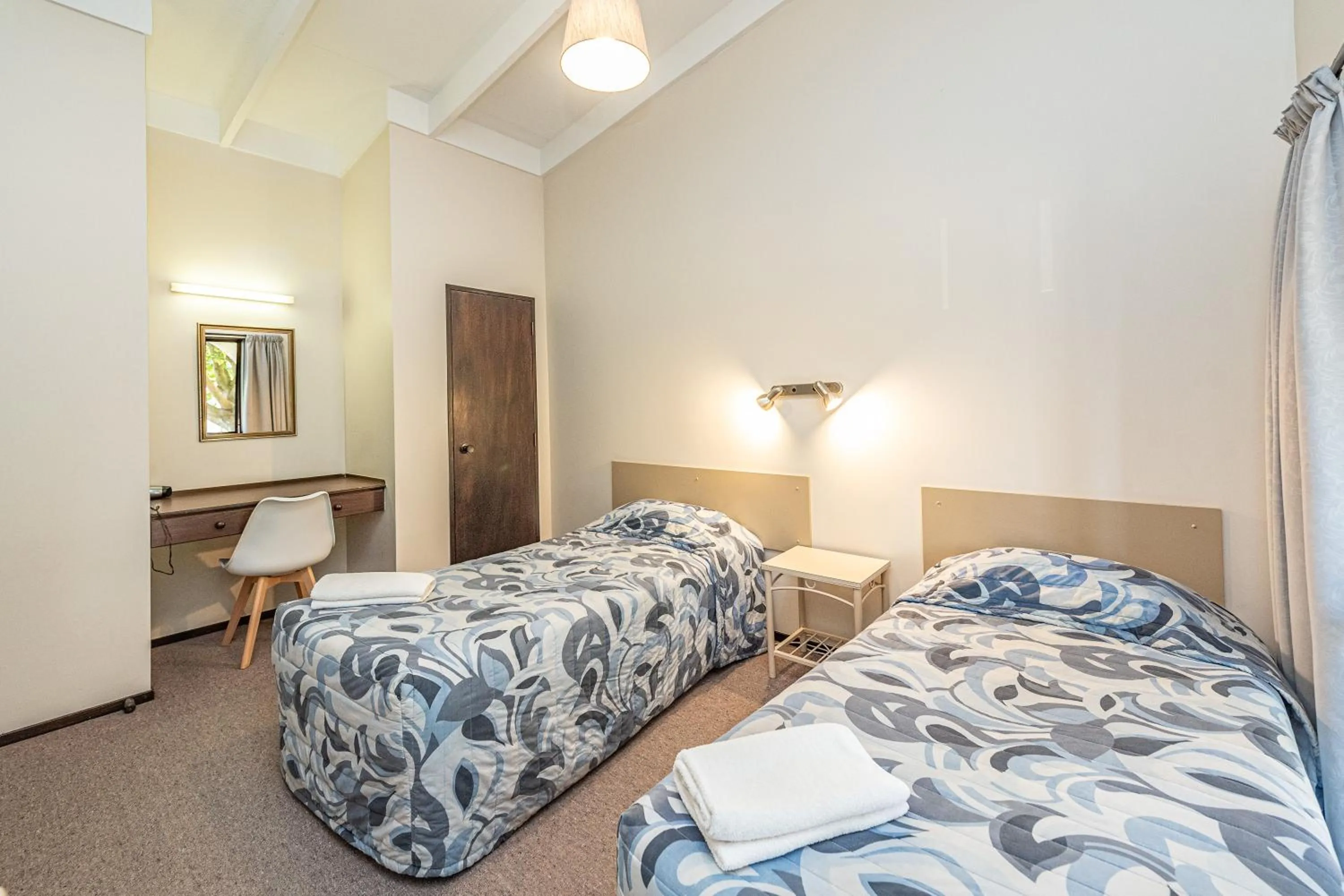 Bed in Riverside Motel