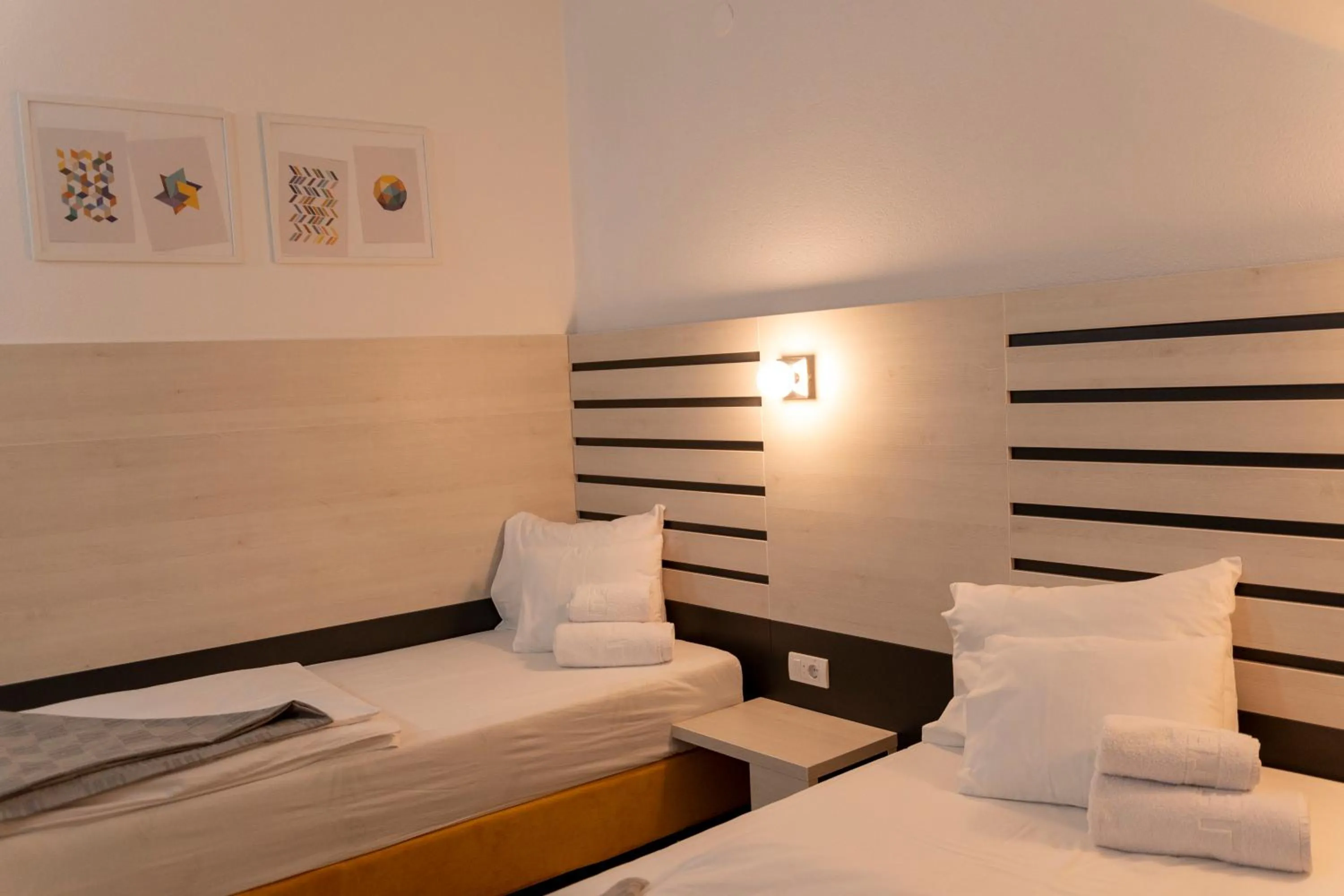 Bed in Garni Hotel 11tica DM