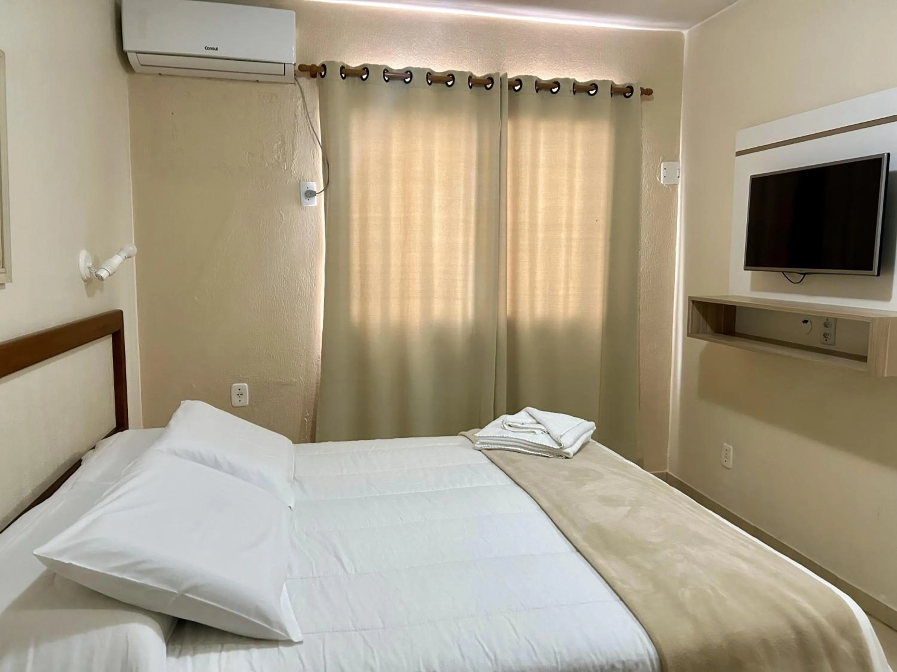 Bed in De Rose Palace Hotel