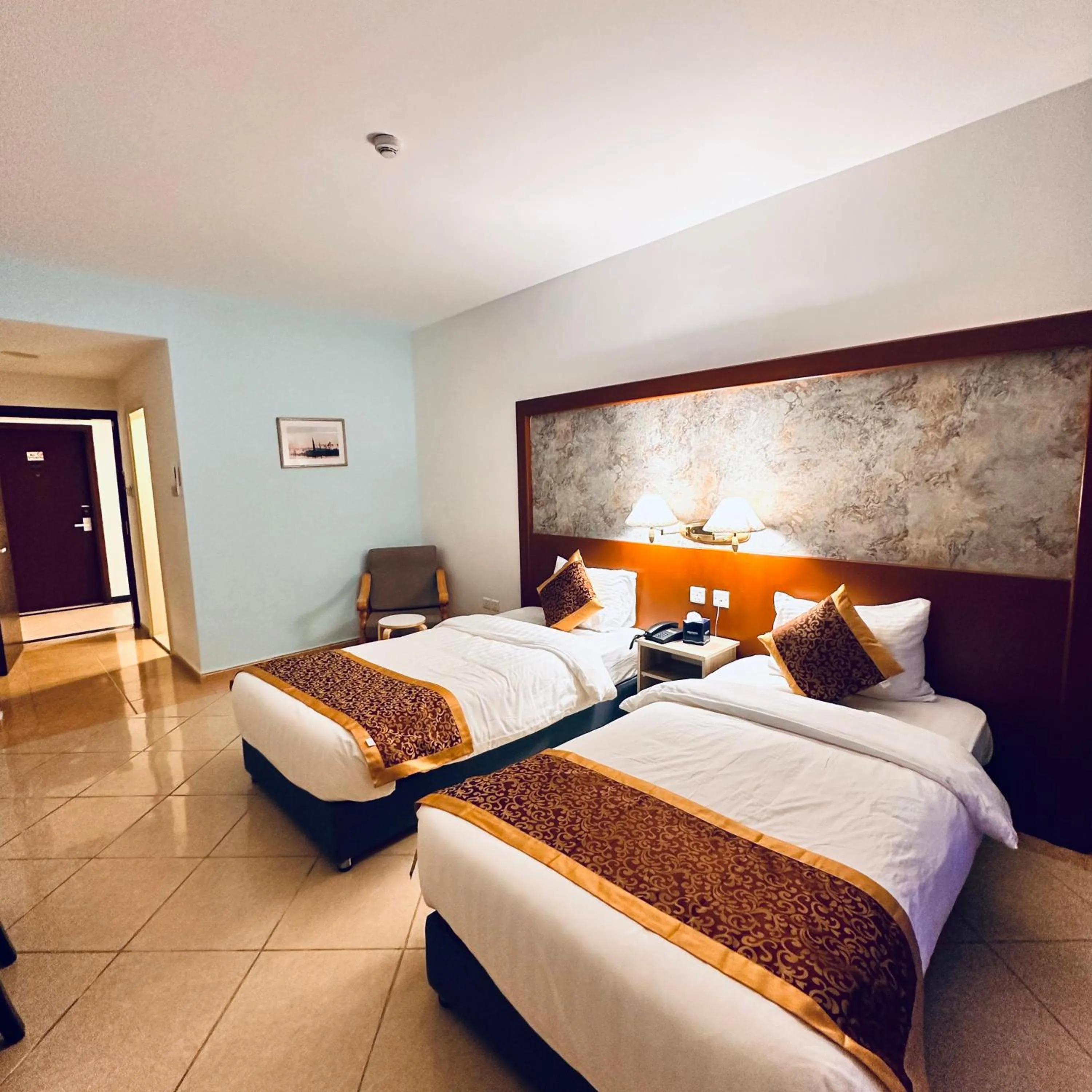 Bed in Aquavista Hotel & Suites