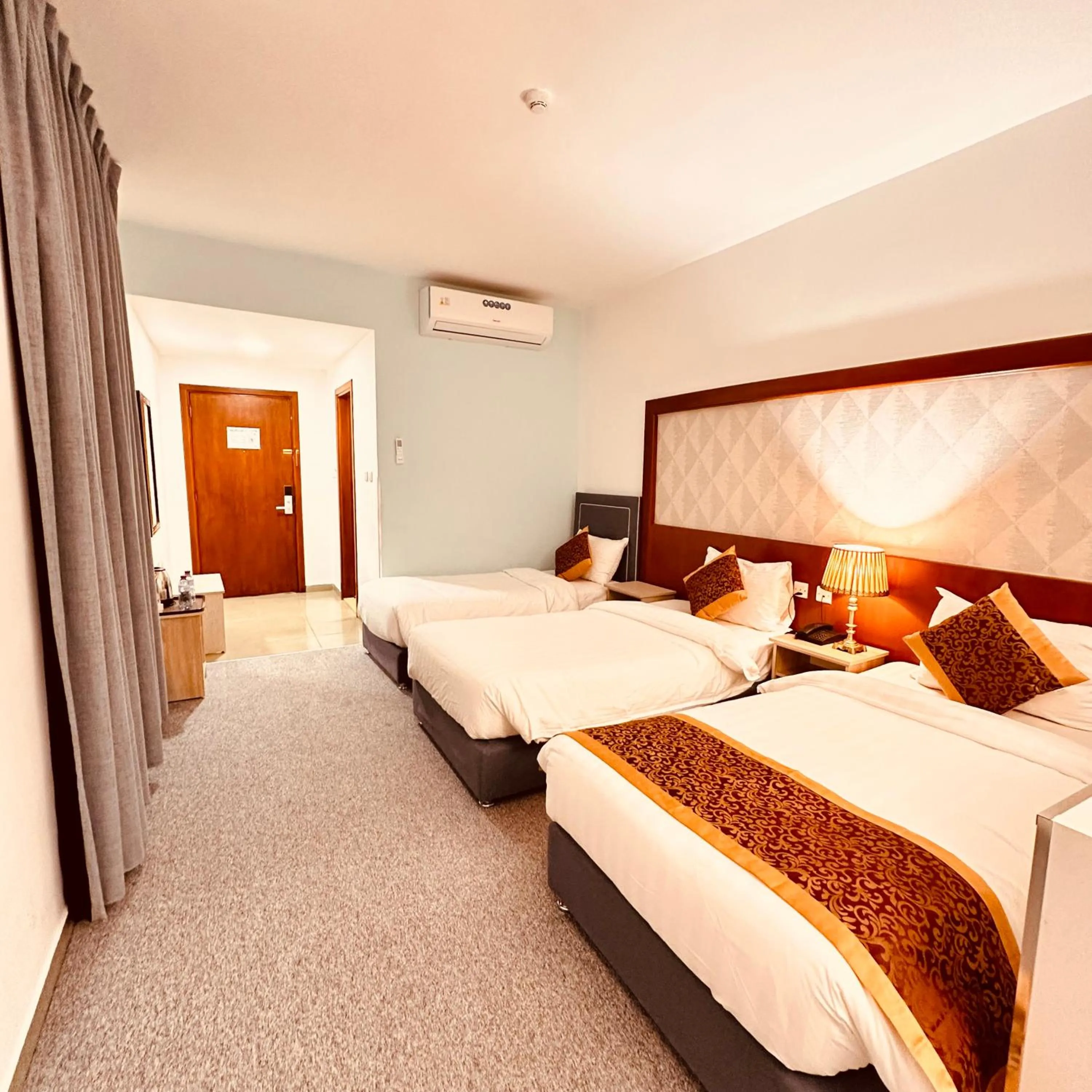 Bed in Aquavista Hotel & Suites