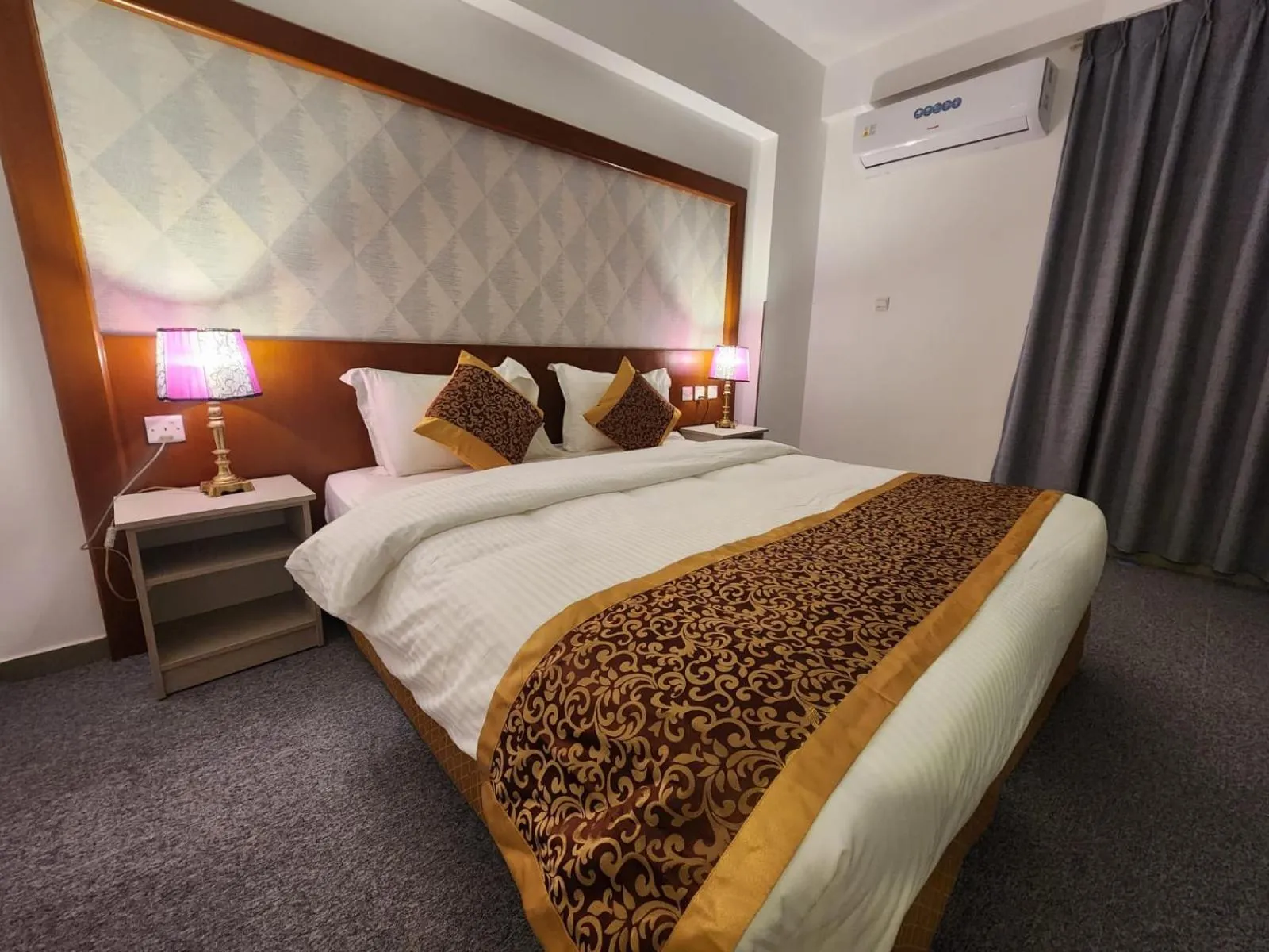 Bed in Aquavista Hotel & Suites