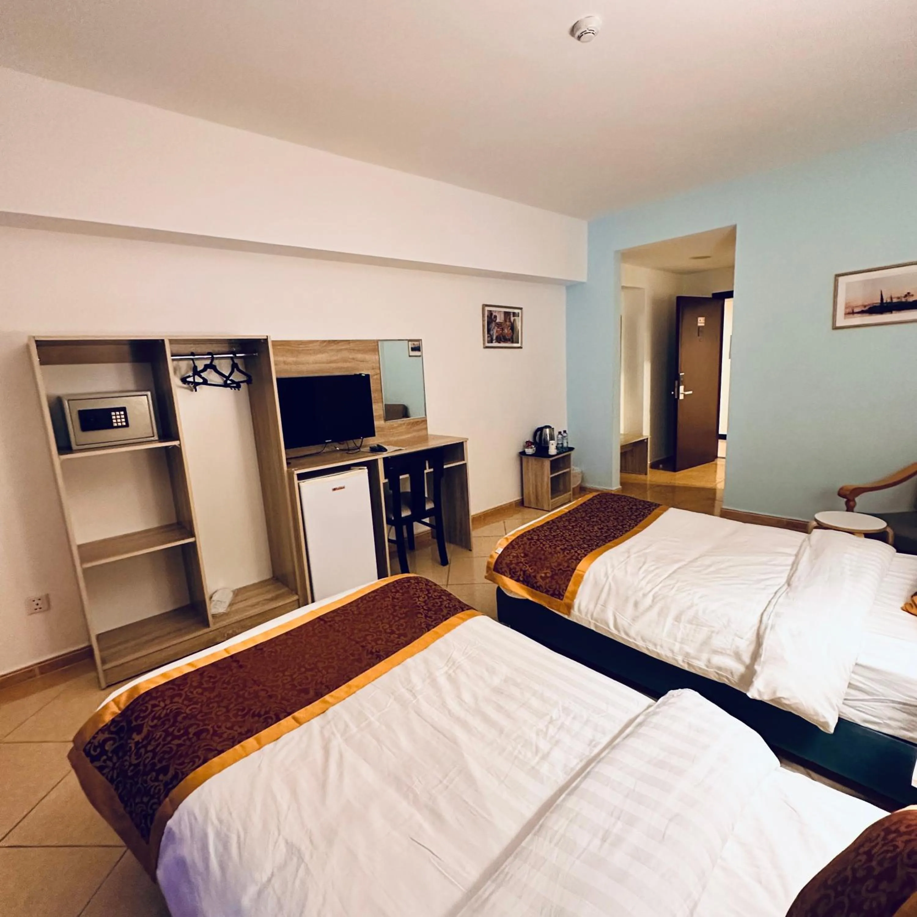 Bed in Aquavista Hotel & Suites