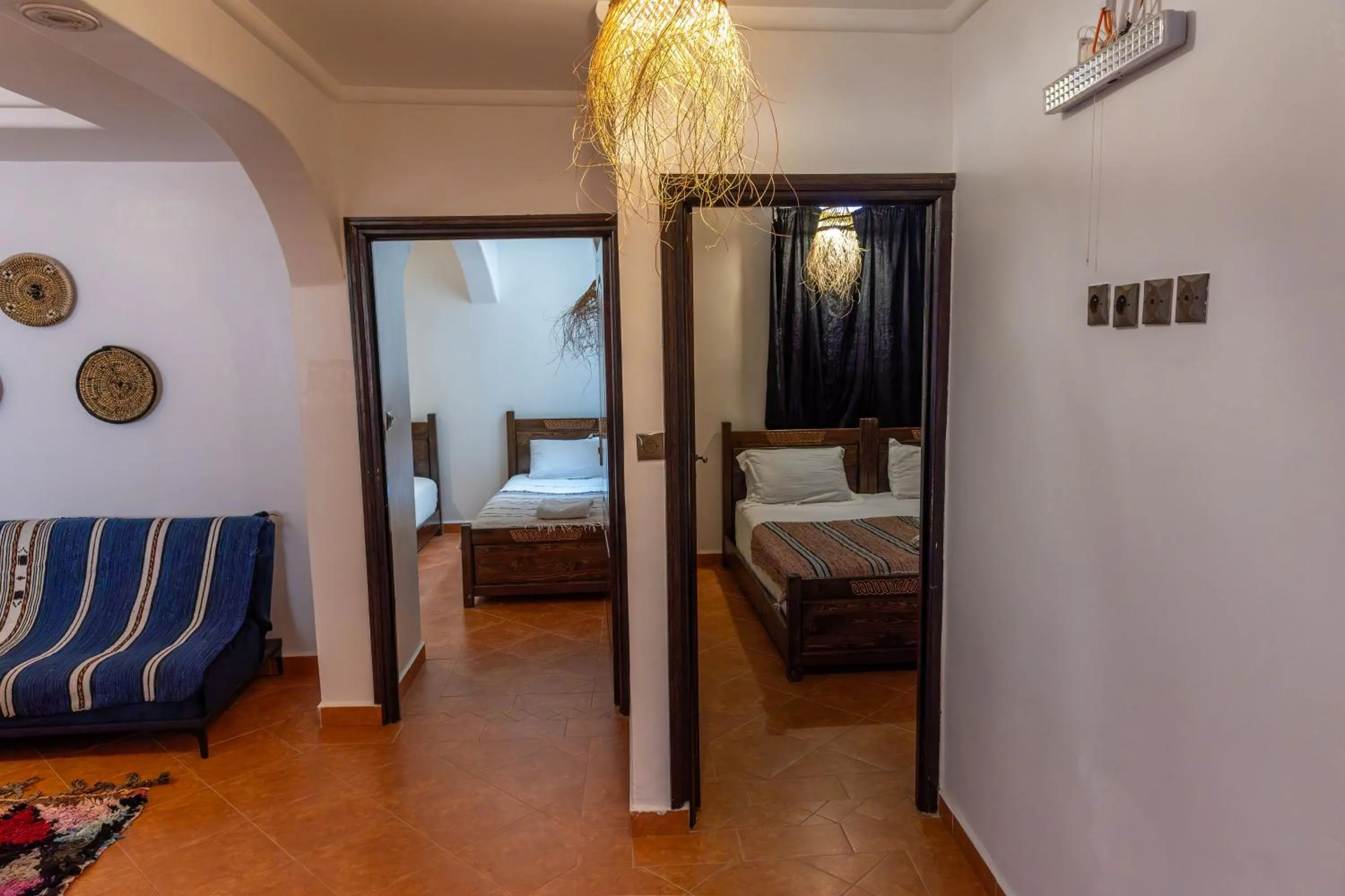 Seating area, Bed in Hola Surf Morocco