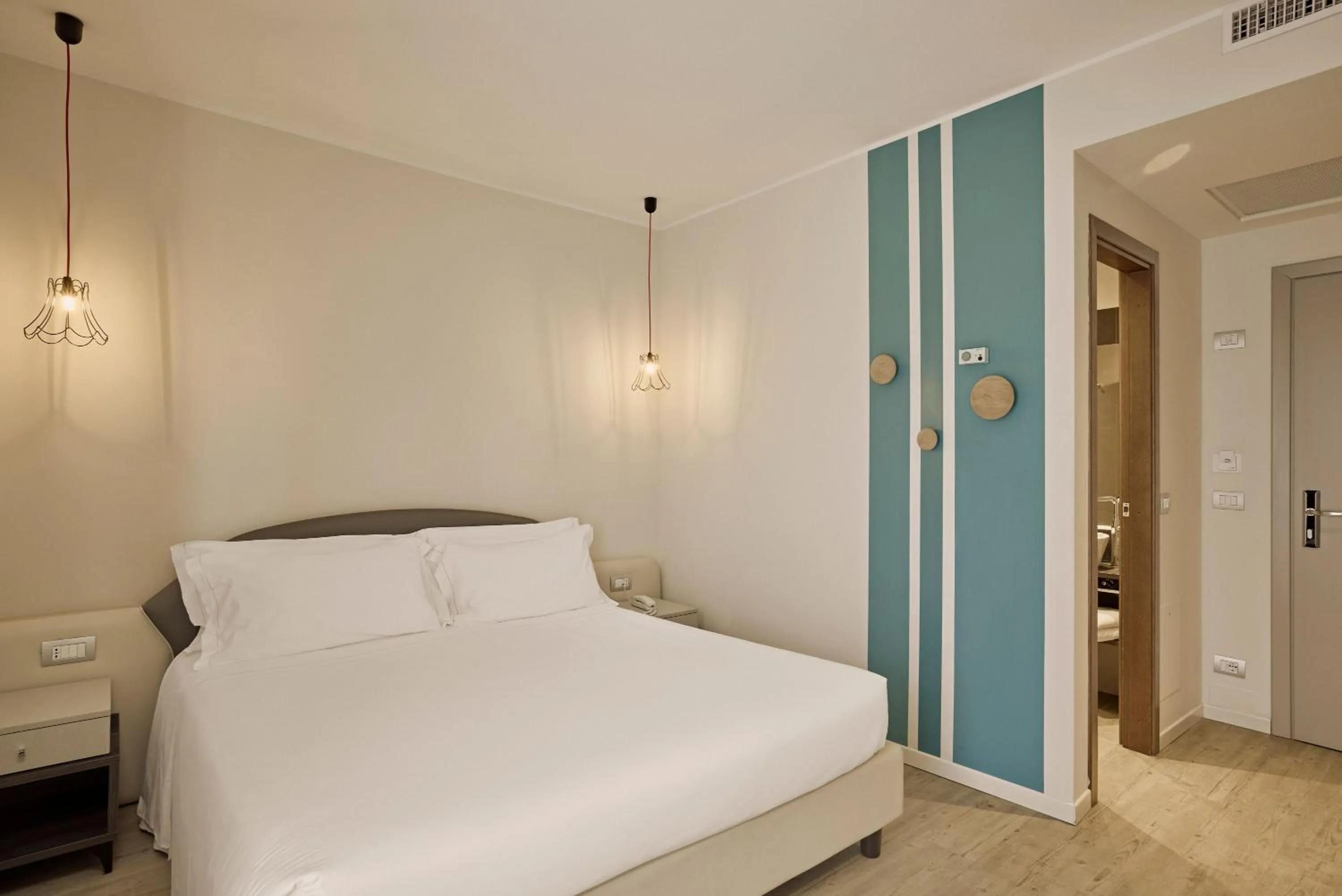 Bed in Hotel Le Mura